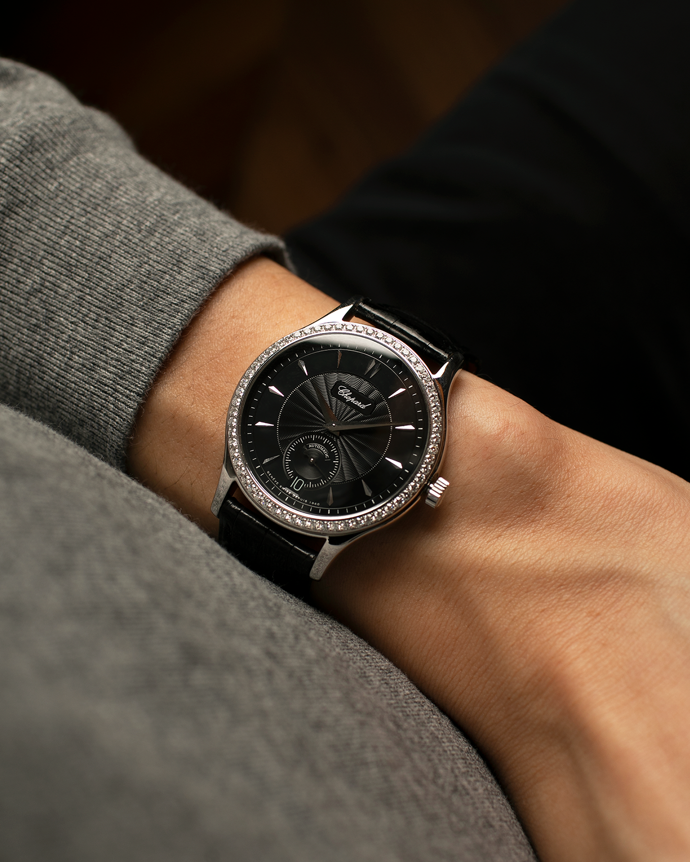 Brand: Chopard L.U.C.
Year: Late 1990s
Model: 17/1860/2
Material: 18-carat White Gold Case, Factory-Set Diamond Bezel
Movement: Chopard Cal. 1.96, Self-Winding Micro-Rotor
Case Dimensions: 37mm x 8.5mm (Lug-to-Lug 45mm)
Lug Width: 18mm
Strap: Chopard Black Alligator Leather Strap with Signed 18-carat White Gold Tang Buckle