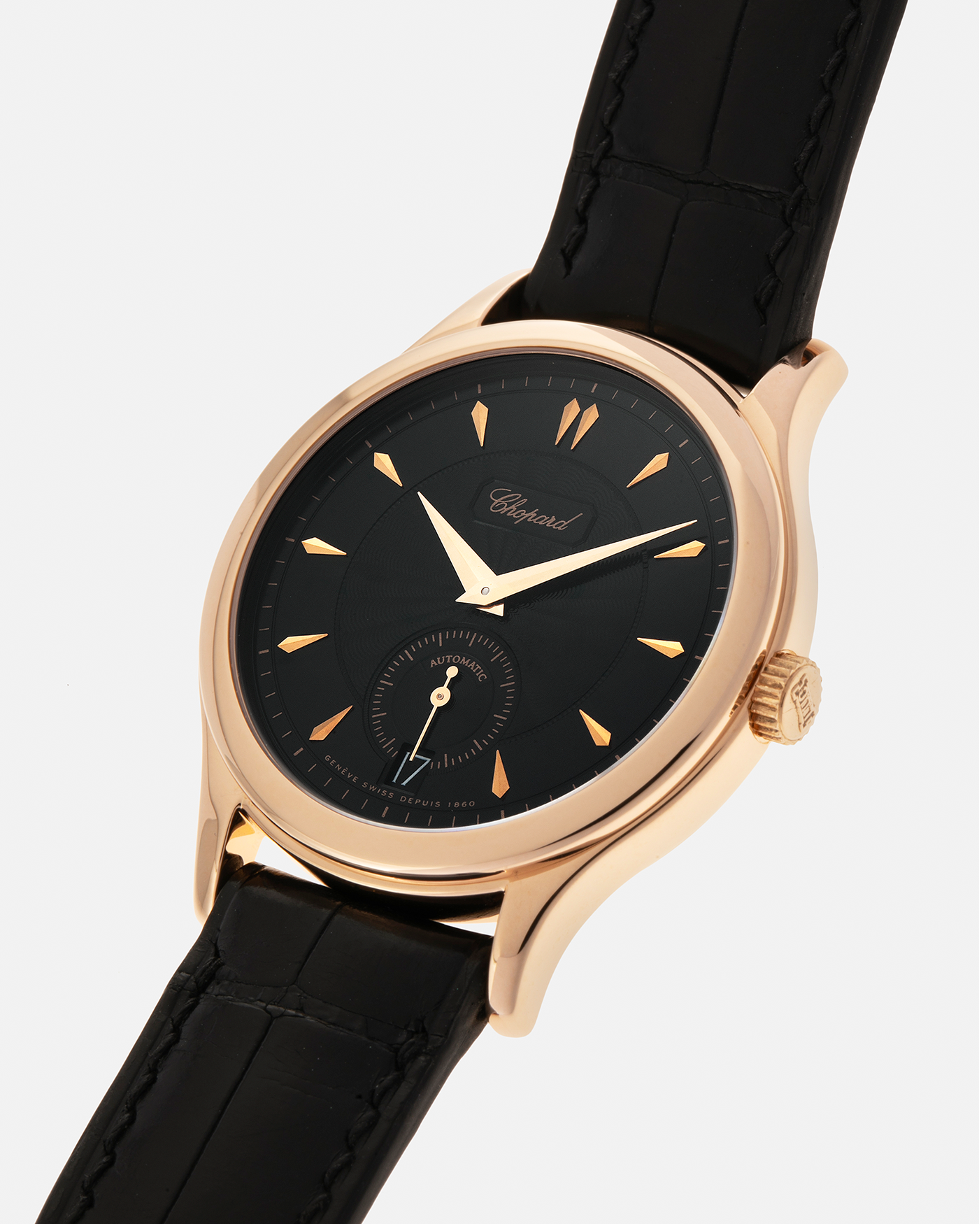 Brand: Chopard L.U.C.
Year: 1990’s
Model: 16/1860/2
Material: 18-carat Rose Gold
Movement: Chopard Cal. 1.96, Self-Winding Micro-Rotor
Case Diameter: 37mm x 8.5mm (Lug-to-Lug 45mm)
Lug Width: 18mm
Strap: Delugs Black Alligator Leather Strap with signed 18-carat Rose Gold Tang Buckle, extra Chopard Black Alligator Leather Strap