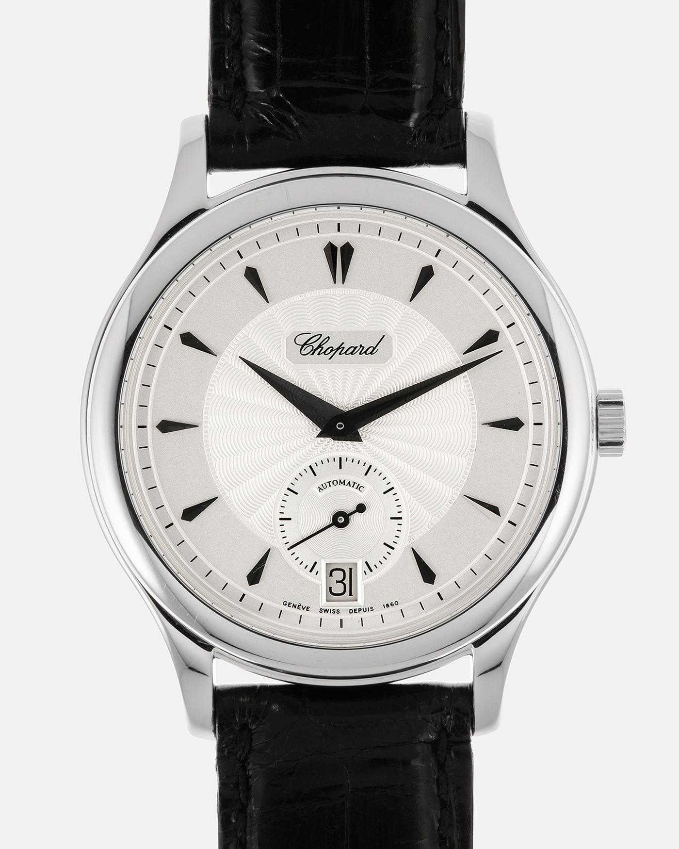Brand: Chopard L.U.C.
Year: 1990’s
Model: 16/1860/2
Material: 18-carat White Gold
Movement: Chopard Cal. 1.96, Self-Winding Micro-Rotor
Case Dimensions: 37mm x 8.5mm (Lug-to-Lug 45mm)
Lug Width: 18mm
Strap: Chopard Black Alligator Leather Strap with Signed 18-carat White Gold Tang Buckle