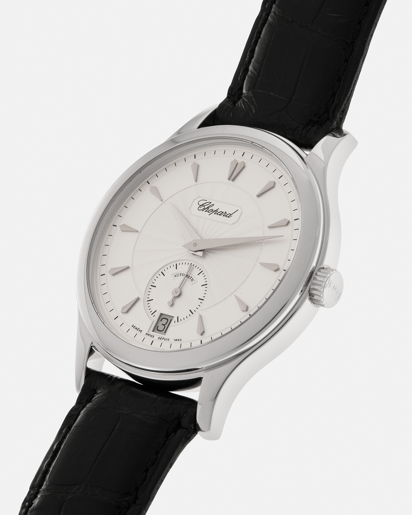 Brand: Chopard L.U.C.
Year: 1990’s
Model: 16/1860/2
Material: 18-carat White Gold
Movement: Chopard Cal. 1.96, Self-Winding Micro-Rotor
Case Dimensions: 37mm x 8.5mm (Lug-to-Lug 45mm)
Lug Width: 18mm
Strap: Chopard Black Alligator Leather Strap with Signed 18-carat White Gold Tang Buckle