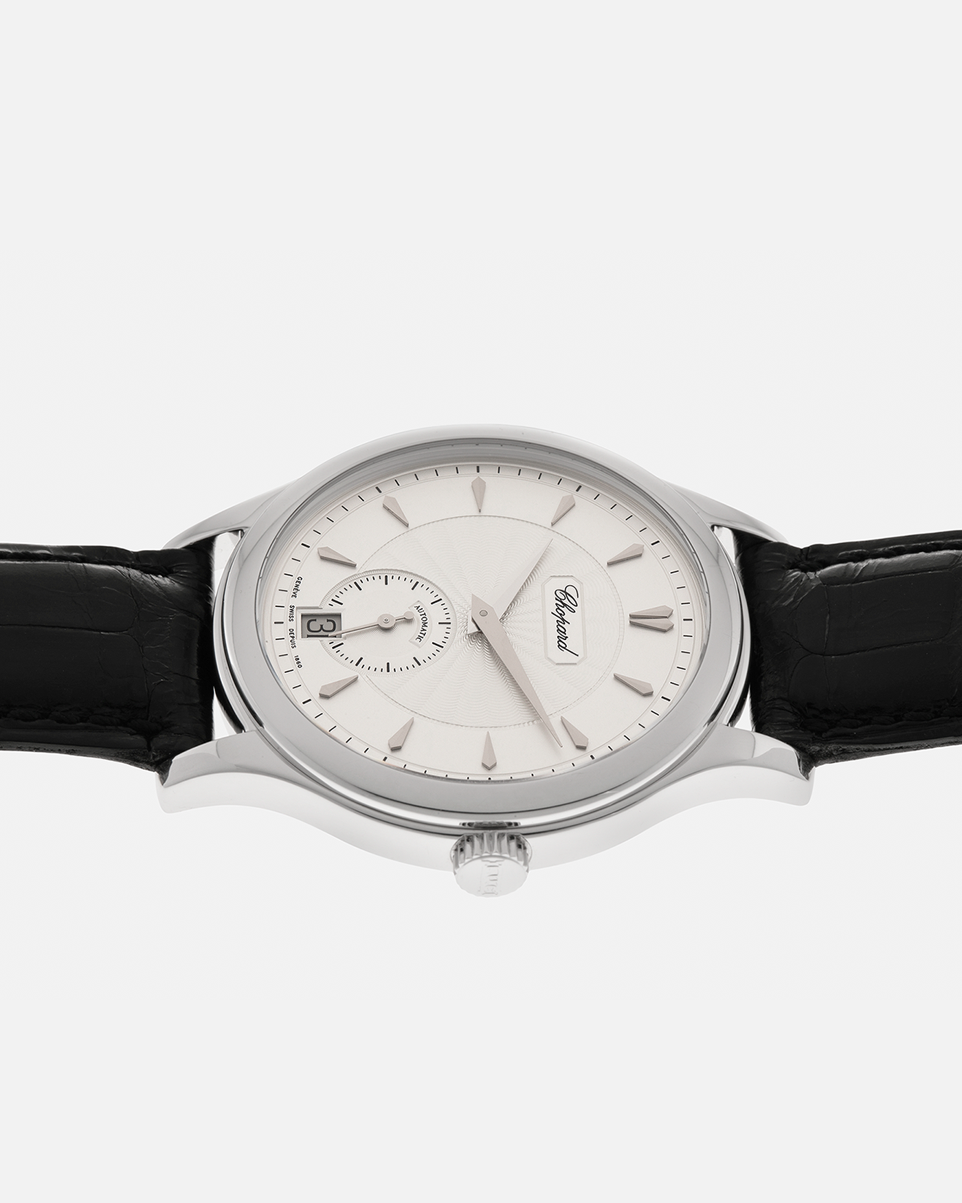 Brand: Chopard L.U.C.
Year: 1990’s
Model: 16/1860/2
Material: 18-carat White Gold
Movement: Chopard Cal. 1.96, Self-Winding Micro-Rotor
Case Dimensions: 37mm x 8.5mm (Lug-to-Lug 45mm)
Lug Width: 18mm
Strap: Chopard Black Alligator Leather Strap with Signed 18-carat White Gold Tang Buckle