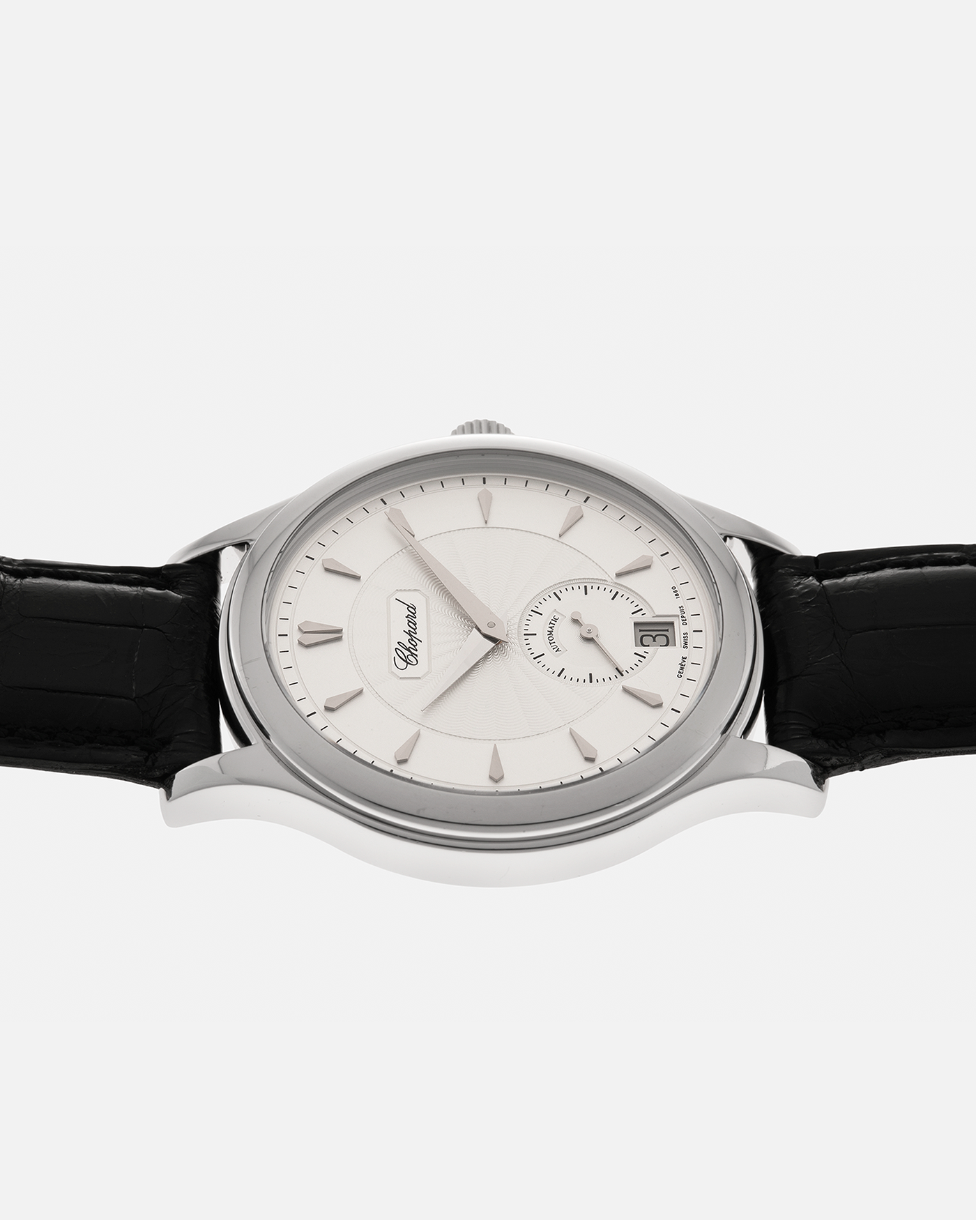Brand: Chopard L.U.C.
Year: 1990’s
Model: 16/1860/2
Material: 18-carat White Gold
Movement: Chopard Cal. 1.96, Self-Winding Micro-Rotor
Case Dimensions: 37mm x 8.5mm (Lug-to-Lug 45mm)
Lug Width: 18mm
Strap: Chopard Black Alligator Leather Strap with Signed 18-carat White Gold Tang Buckle