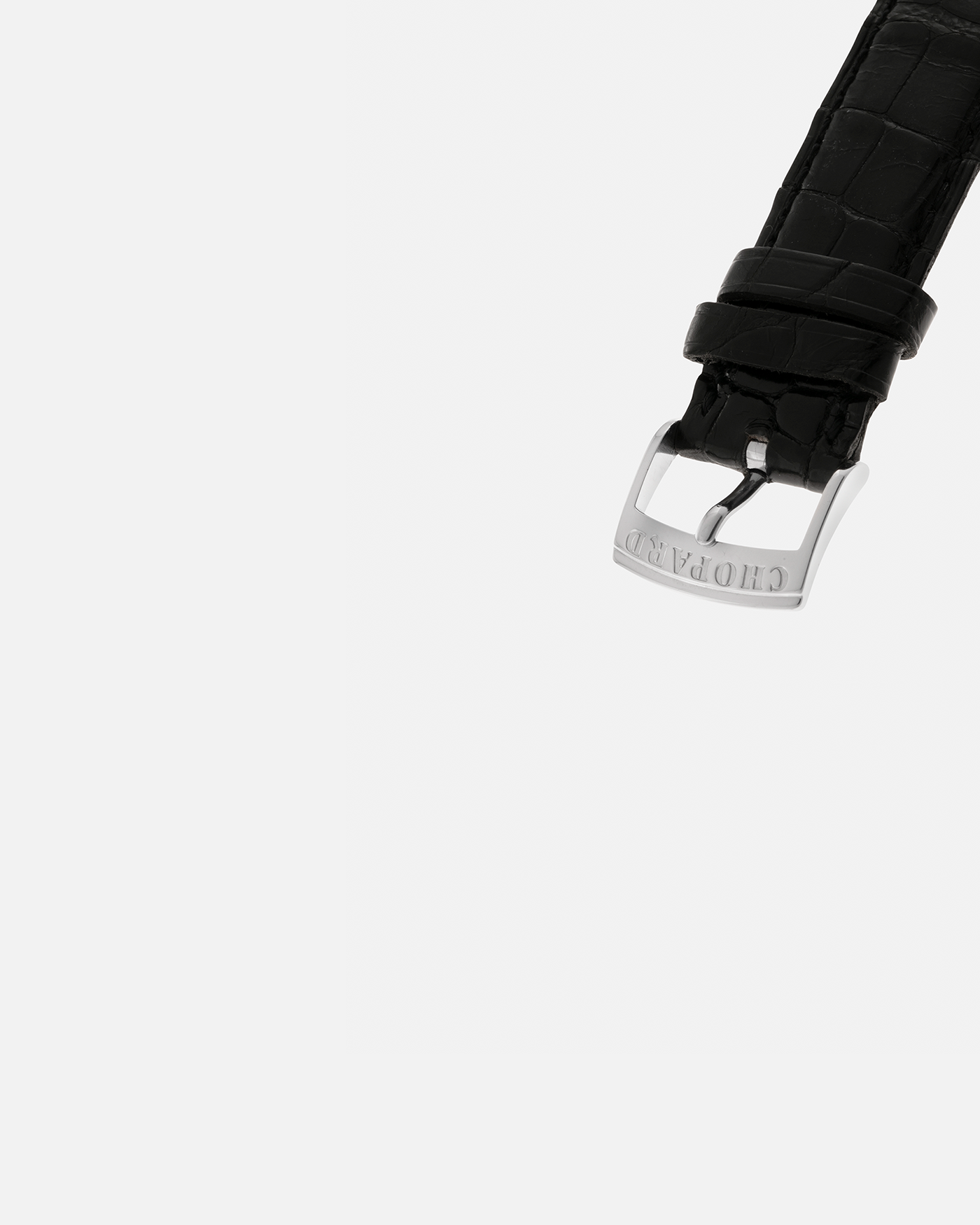 Brand: Chopard L.U.C.
Year: 1990’s
Model: 16/1860/2
Material: 18-carat White Gold
Movement: Chopard Cal. 1.96, Self-Winding Micro-Rotor
Case Dimensions: 37mm x 8.5mm (Lug-to-Lug 45mm)
Lug Width: 18mm
Strap: Chopard Black Alligator Leather Strap with Signed 18-carat White Gold Tang Buckle