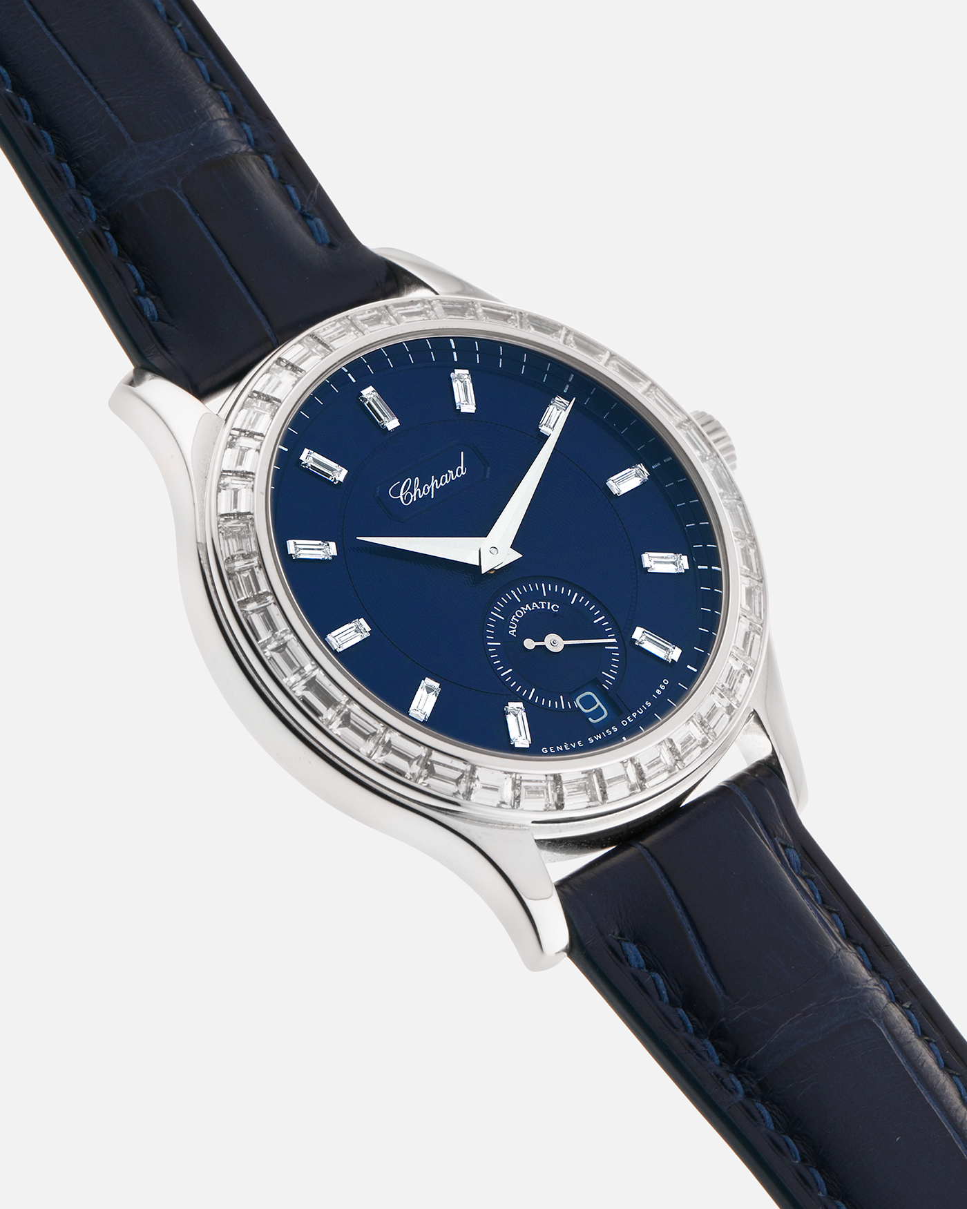 Brand: Chopard L.U.C.
Year: 2000’s
Model: 16/1864/2 Based Off 16/1860/2
Material: 18-carat White Gold Case, Factory-Set Baguette Diamond Bezel and Dial
Movement: Chopard Cal. 1.96, Self-Winding Micro-Rotor
Case Dimensions: 37mm Diameter 8.5mm Thickness
Lug Width: 18mm
Strap: Custom Order Blue Alligator Leather Strap with 18k White Gold Chopard Tang Buckle