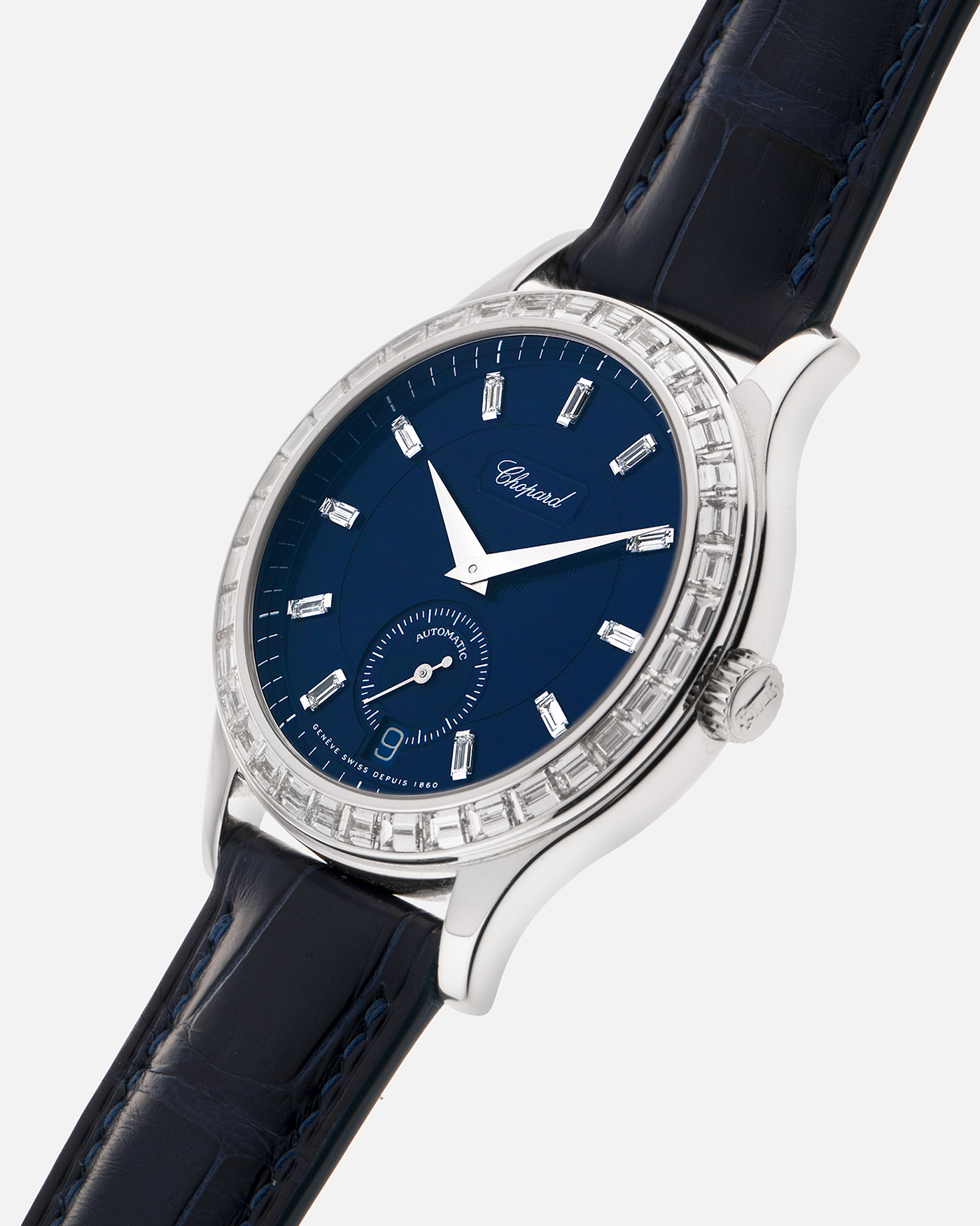 Brand: Chopard L.U.C.
Year: 2000’s
Model: 16/1864/2 Based Off 16/1860/2
Material: 18-carat White Gold Case, Factory-Set Baguette Diamond Bezel and Dial
Movement: Chopard Cal. 1.96, Self-Winding Micro-Rotor
Case Dimensions: 37mm Diameter 8.5mm Thickness
Lug Width: 18mm
Strap: Custom Order Blue Alligator Leather Strap with 18k White Gold Chopard Tang Buckle