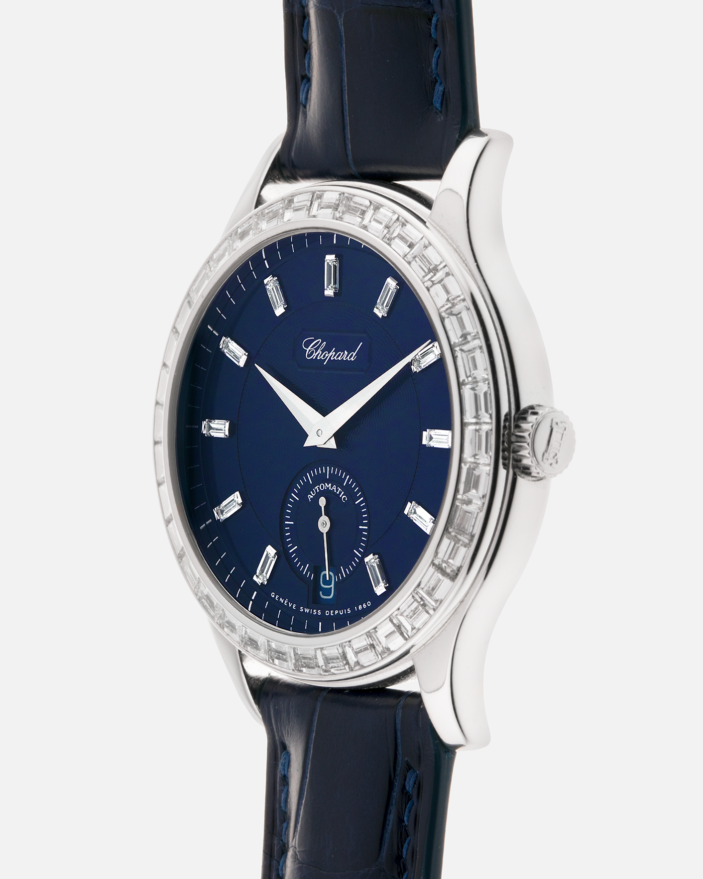 Brand: Chopard L.U.C.
Year: 2000’s
Model: 16/1864/2 Based Off 16/1860/2
Material: 18-carat White Gold Case, Factory-Set Baguette Diamond Bezel and Dial
Movement: Chopard Cal. 1.96, Self-Winding Micro-Rotor
Case Dimensions: 37mm Diameter 8.5mm Thickness
Lug Width: 18mm
Strap: Custom Order Blue Alligator Leather Strap with 18k White Gold Chopard Tang Buckle
