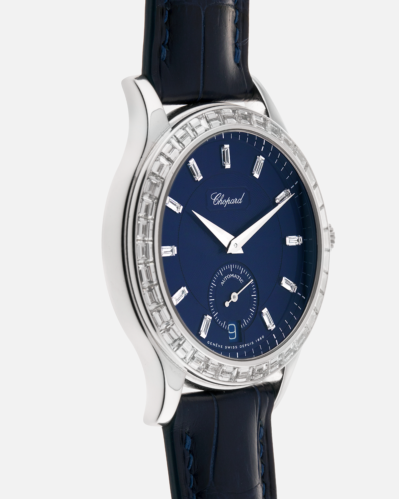 Brand: Chopard L.U.C.
Year: 2000’s
Model: 16/1864/2 Based Off 16/1860/2
Material: 18-carat White Gold Case, Factory-Set Baguette Diamond Bezel and Dial
Movement: Chopard Cal. 1.96, Self-Winding Micro-Rotor
Case Dimensions: 37mm Diameter 8.5mm Thickness
Lug Width: 18mm
Strap: Custom Order Blue Alligator Leather Strap with 18k White Gold Chopard Tang Buckle