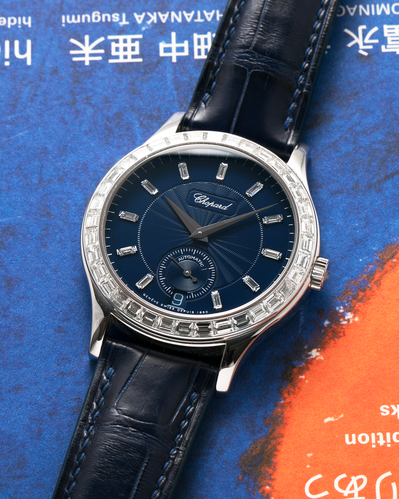 Brand: Chopard L.U.C.
Year: 2000’s
Model: 16/1864/2 Based Off 16/1860/2
Material: 18-carat White Gold Case, Factory-Set Baguette Diamond Bezel and Dial
Movement: Chopard Cal. 1.96, Self-Winding Micro-Rotor
Case Dimensions: 37mm Diameter 8.5mm Thickness
Lug Width: 18mm
Strap: Custom Order Blue Alligator Leather Strap with 18k White Gold Chopard Tang Buckle
