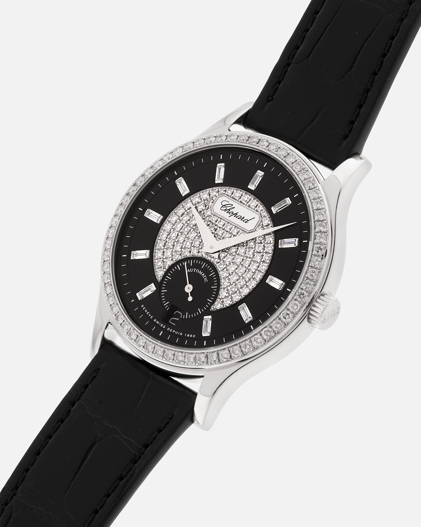 Brand: Chopard L.U.C.
Year: 2000’s
Model: 17/1873/2 Based Off 16/1860/2
Material: 18-carat White Gold Case, Factory-Set Diamond Bezel and Dial
Movement: Chopard Cal. 1.96, Self-Winding Micro-Rotor
Case Dimensions: 37mm Diameter 8.5mm Thickness
Lug Width: 18mm
Strap: Chopard Black Alligator Strap with 18k White Gold Chopard Tang Buckle