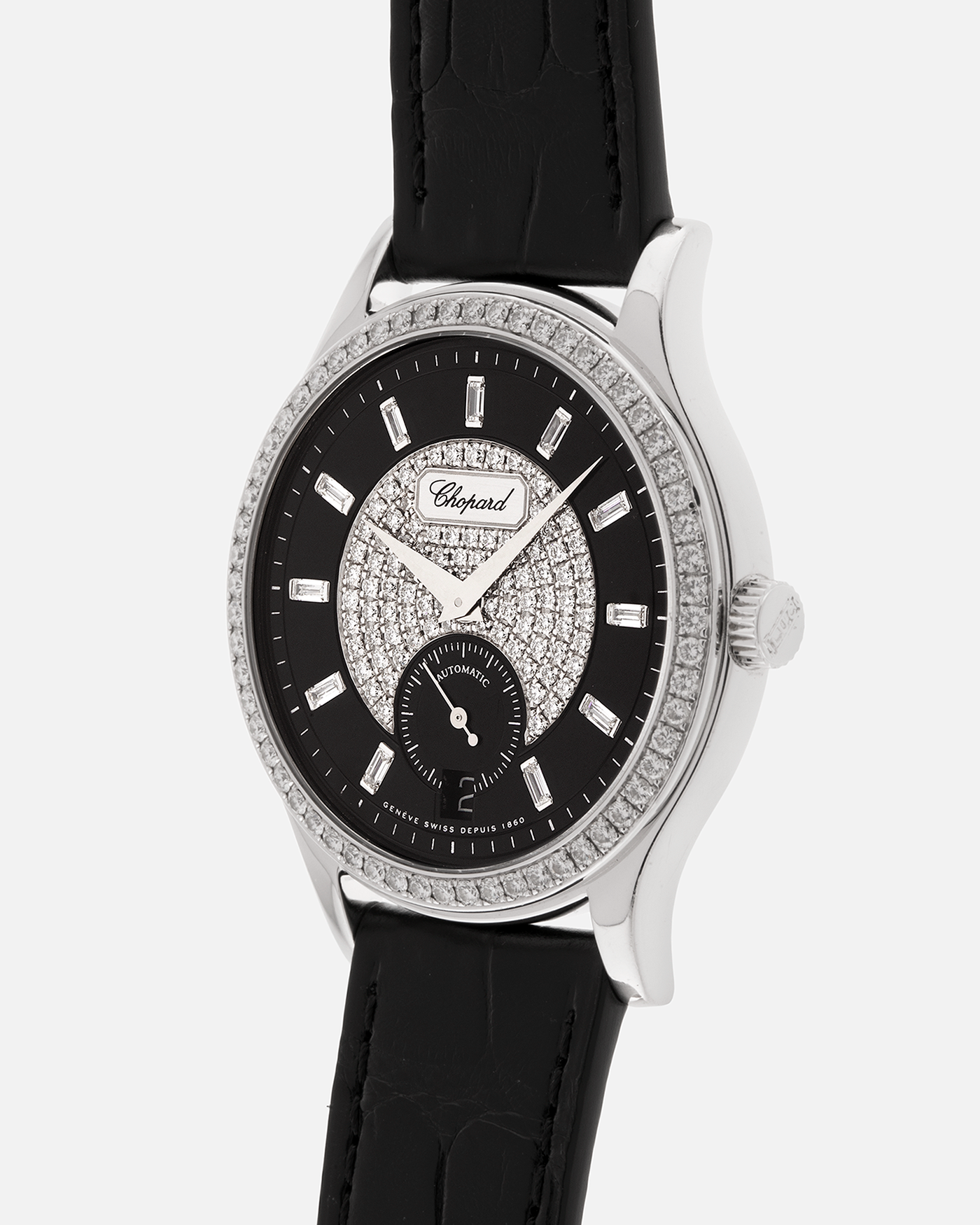 Brand: Chopard L.U.C.
Year: 2000’s
Model: 17/1873/2 Based Off 16/1860/2
Material: 18-carat White Gold Case, Factory-Set Diamond Bezel and Dial
Movement: Chopard Cal. 1.96, Self-Winding Micro-Rotor
Case Dimensions: 37mm Diameter 8.5mm Thickness
Lug Width: 18mm
Strap: Chopard Black Alligator Strap with 18k White Gold Chopard Tang Buckle