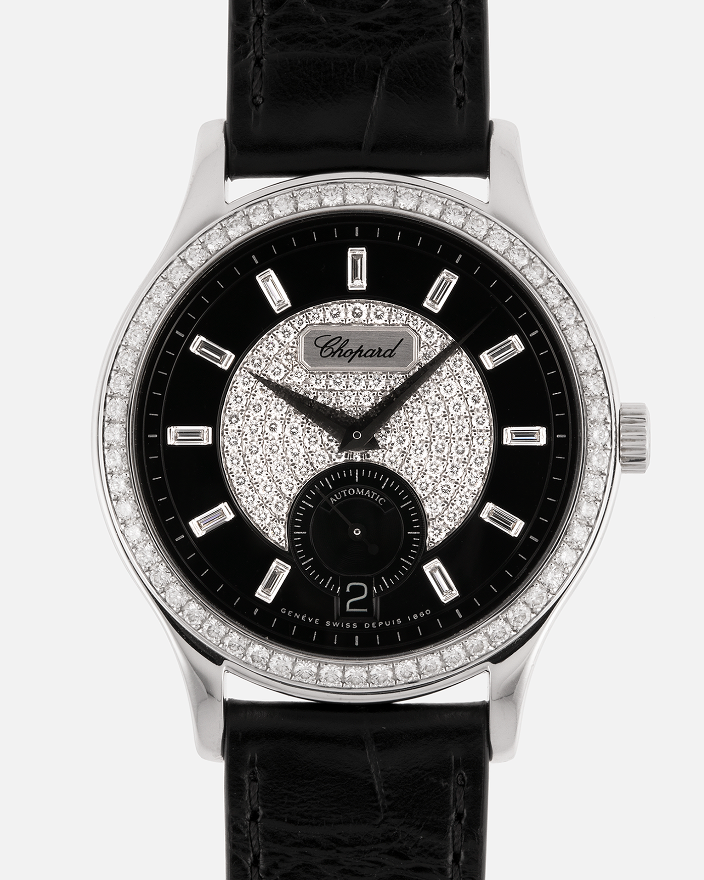 Brand: Chopard L.U.C.
Year: 2000’s
Model: 17/1873/2 Based Off 16/1860/2
Material: 18-carat White Gold Case, Factory-Set Diamond Bezel and Dial
Movement: Chopard Cal. 1.96, Self-Winding Micro-Rotor
Case Dimensions: 37mm Diameter 8.5mm Thickness
Lug Width: 18mm
Strap: Chopard Black Alligator Strap with 18k White Gold Chopard Tang Buckle