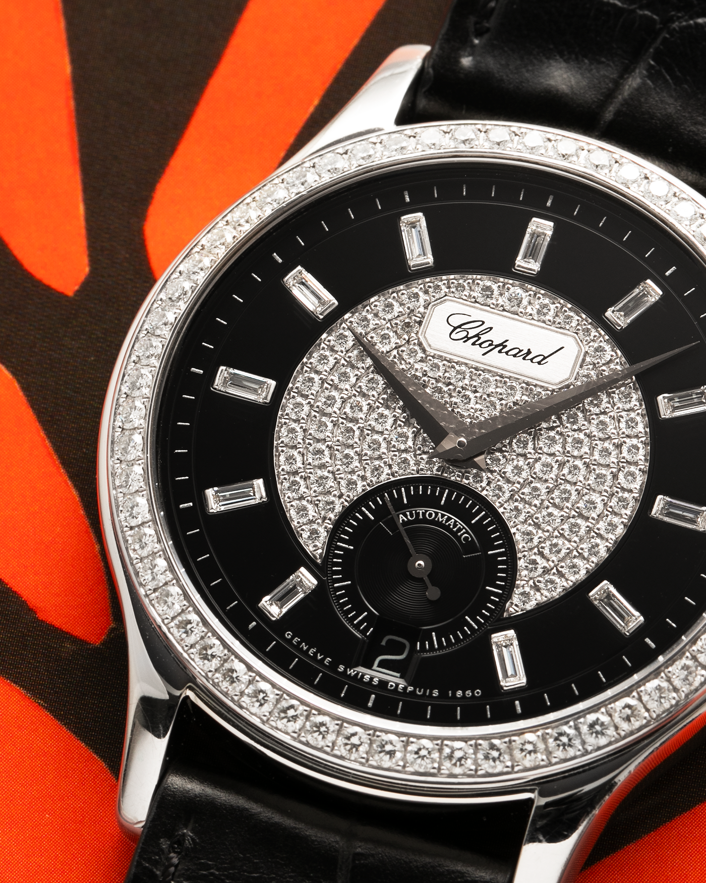 Brand: Chopard L.U.C.
Year: 2000’s
Model: 17/1873/2 Based Off 16/1860/2
Material: 18-carat White Gold Case, Factory-Set Diamond Bezel and Dial
Movement: Chopard Cal. 1.96, Self-Winding Micro-Rotor
Case Dimensions: 37mm Diameter 8.5mm Thickness
Lug Width: 18mm
Strap: Chopard Black Alligator Strap with 18k White Gold Chopard Tang Buckle