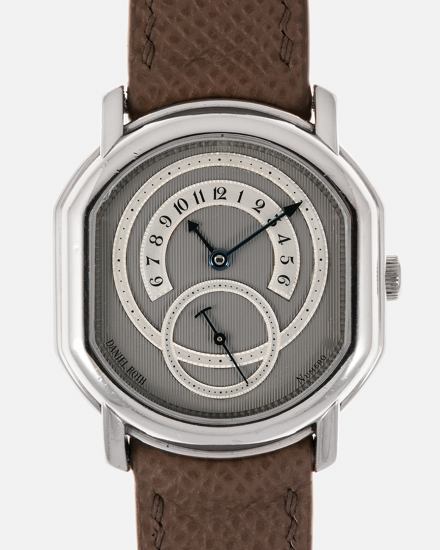 Brand: Daniel Roth Year: 1990’s Model: 2127 Retrograde Material: Platinum 950 Movement: Lemania Cal. 27LN Retrograde, Manual-Winding Case Dimensions: 35mm x 38mm Lug Width: 20mm Strap: Nostime Taupe Grained Calf Leather Strap with Signed Platinum 950 Tang Buckle