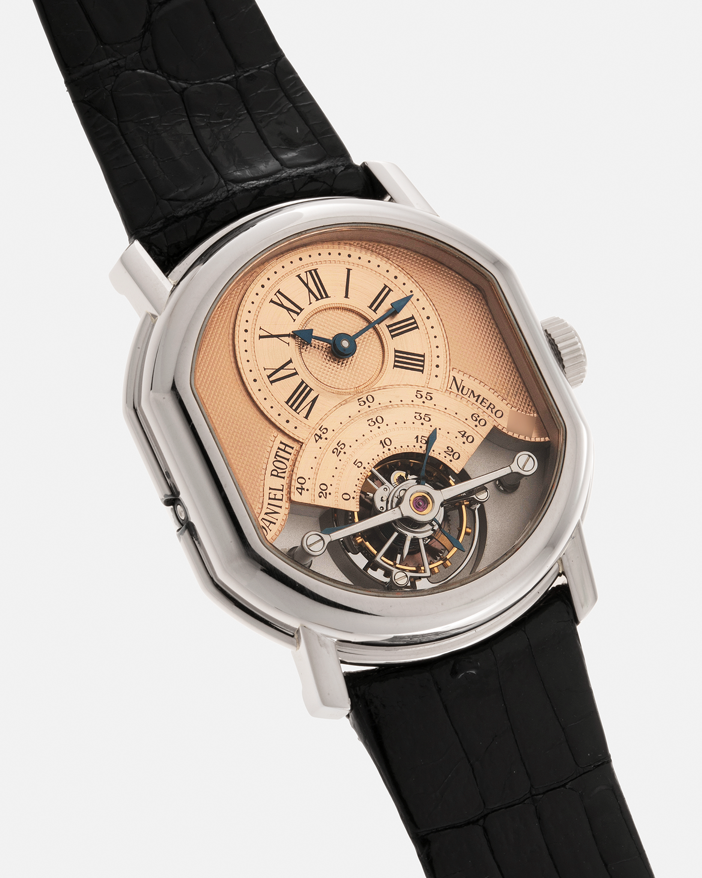 Brand: Daniel Roth Year: 1990’s Model: 2187 Tourbillon (Possibly Piece Unique) Material: 18-Carat White Gold  Movement: Cal. DR 307 One-Minute Tourbillon Regulator, Manual-Winding  Case Diameter: 35mm x 38mm Strap: Daniel Roth Black Alligator Leather with Signed 180carat White Gold Tang Buckle