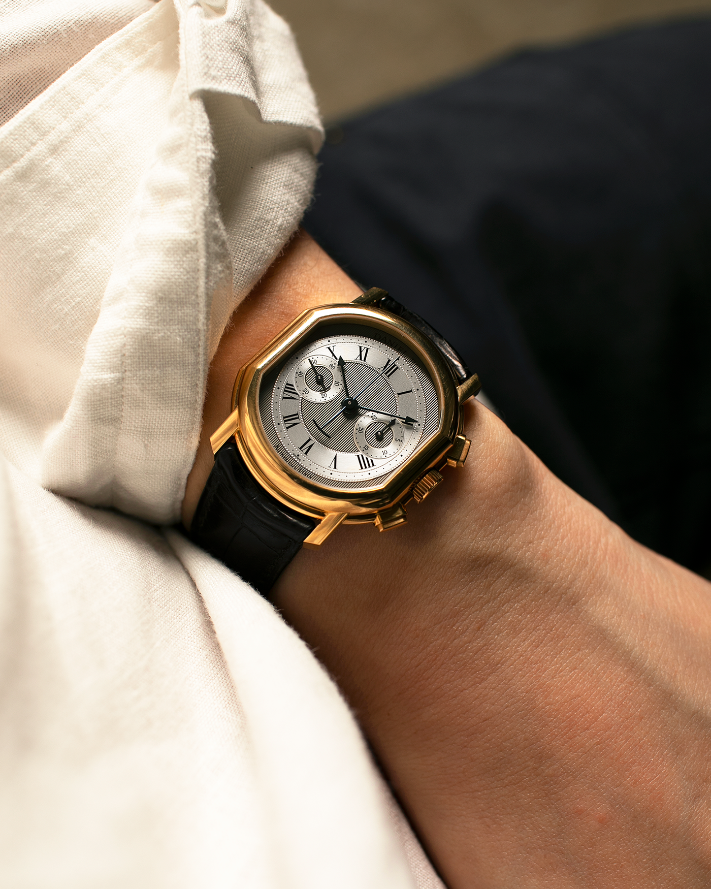 Brand: Daniel Roth
Year: 1990’s
Model: 2147 Chronograph (First Generation)
Material: 18-carat Yellow Gold
Movement: Lemania Cal. 2320, Manual-Winding
Case Dimensions: 35mm x 38mm (Lug-to-Lug 41.5mm)
Lug Width: 20mm
Strap: Daniel Roth Black Alligator Leather Strap with Signed 18-carat Yellow Gold Tang Buckle