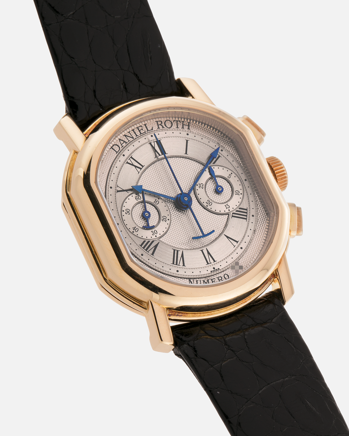 Brand: Daniel Roth
Year: Early 1990s
Model: 2147 Chronograph
Material: 18-carat Yellow Gold
Movement: Lemania Cal. 2320, Manual-Winding
Case Diameter: 35mm x 38mm (10mm Thickness)
Lug Width: 20mm
Strap: Daniel Roth Black Alligator Strap and 18k Yellow Gold Daniel Roth Tang Buckle