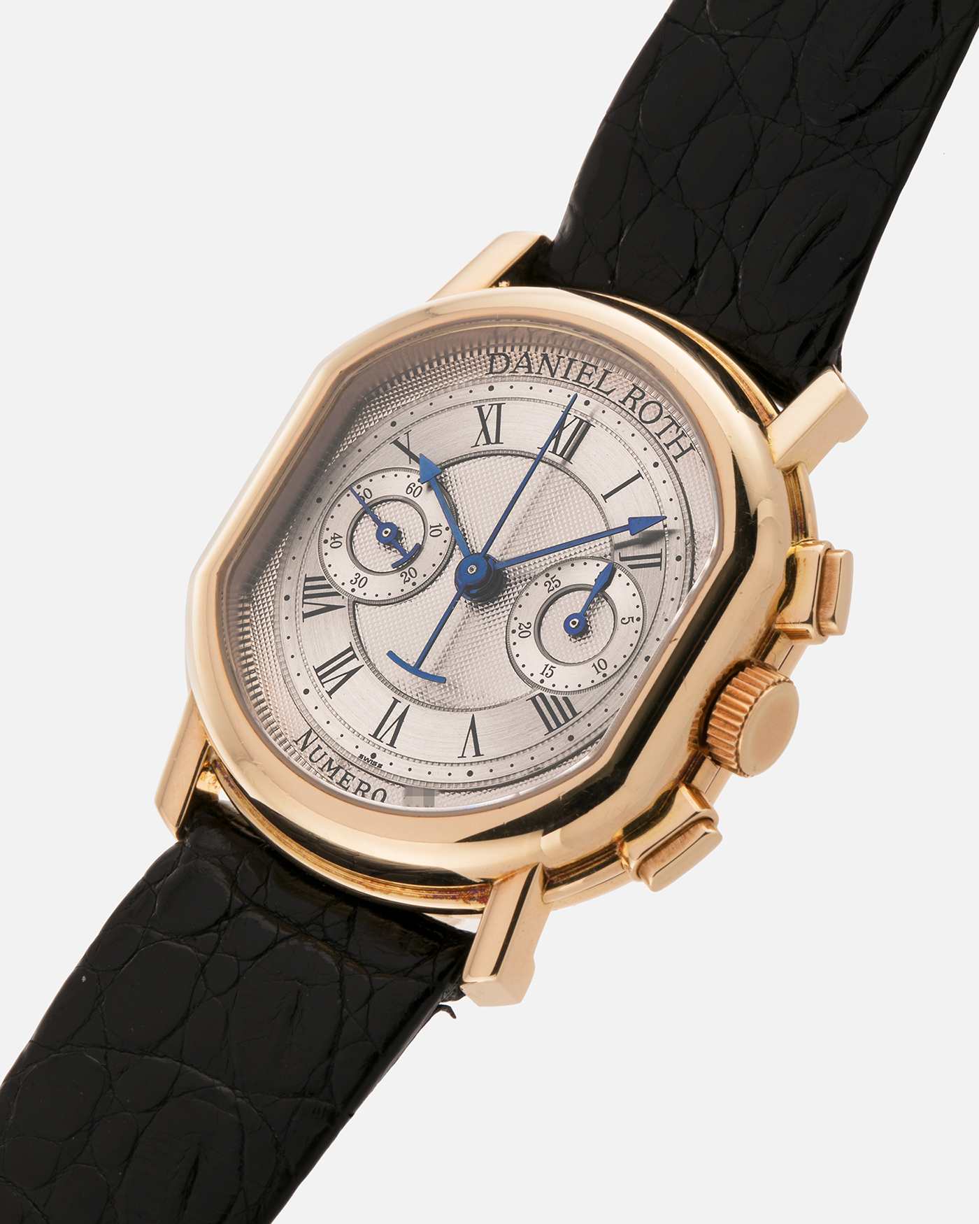 Brand: Daniel Roth
Year: Early 1990s
Model: 2147 Chronograph
Material: 18-carat Yellow Gold
Movement: Lemania Cal. 2320, Manual-Winding
Case Diameter: 35mm x 38mm (10mm Thickness)
Lug Width: 20mm
Strap: Daniel Roth Black Alligator Strap and 18k Yellow Gold Daniel Roth Tang Buckle