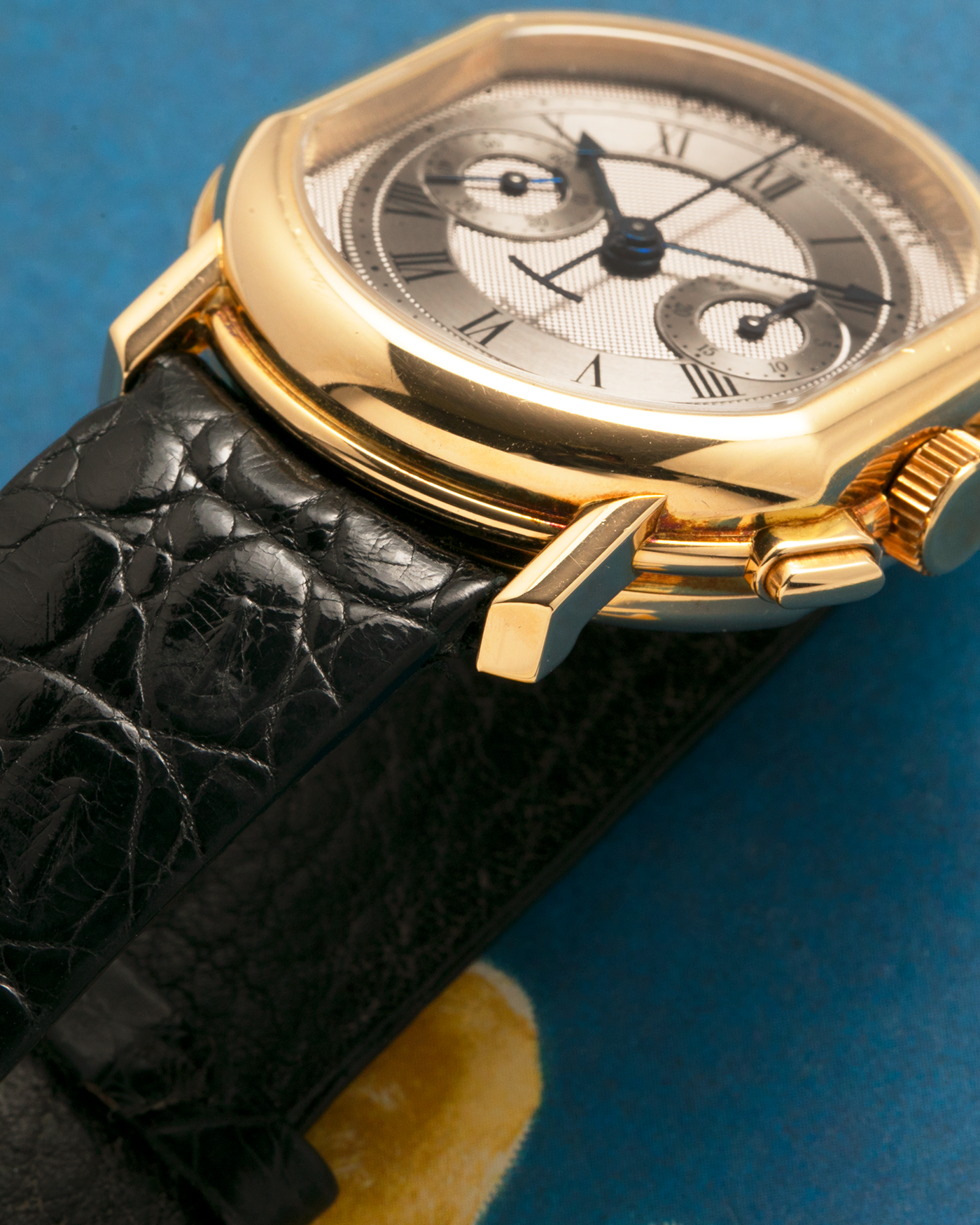 Brand: Daniel Roth
Year: Early 1990s
Model: 2147 Chronograph
Material: 18-carat Yellow Gold
Movement: Lemania Cal. 2320, Manual-Winding
Case Diameter: 35mm x 38mm (10mm Thickness)
Lug Width: 20mm
Strap: Daniel Roth Black Alligator Strap and 18k Yellow Gold Daniel Roth Tang Buckle