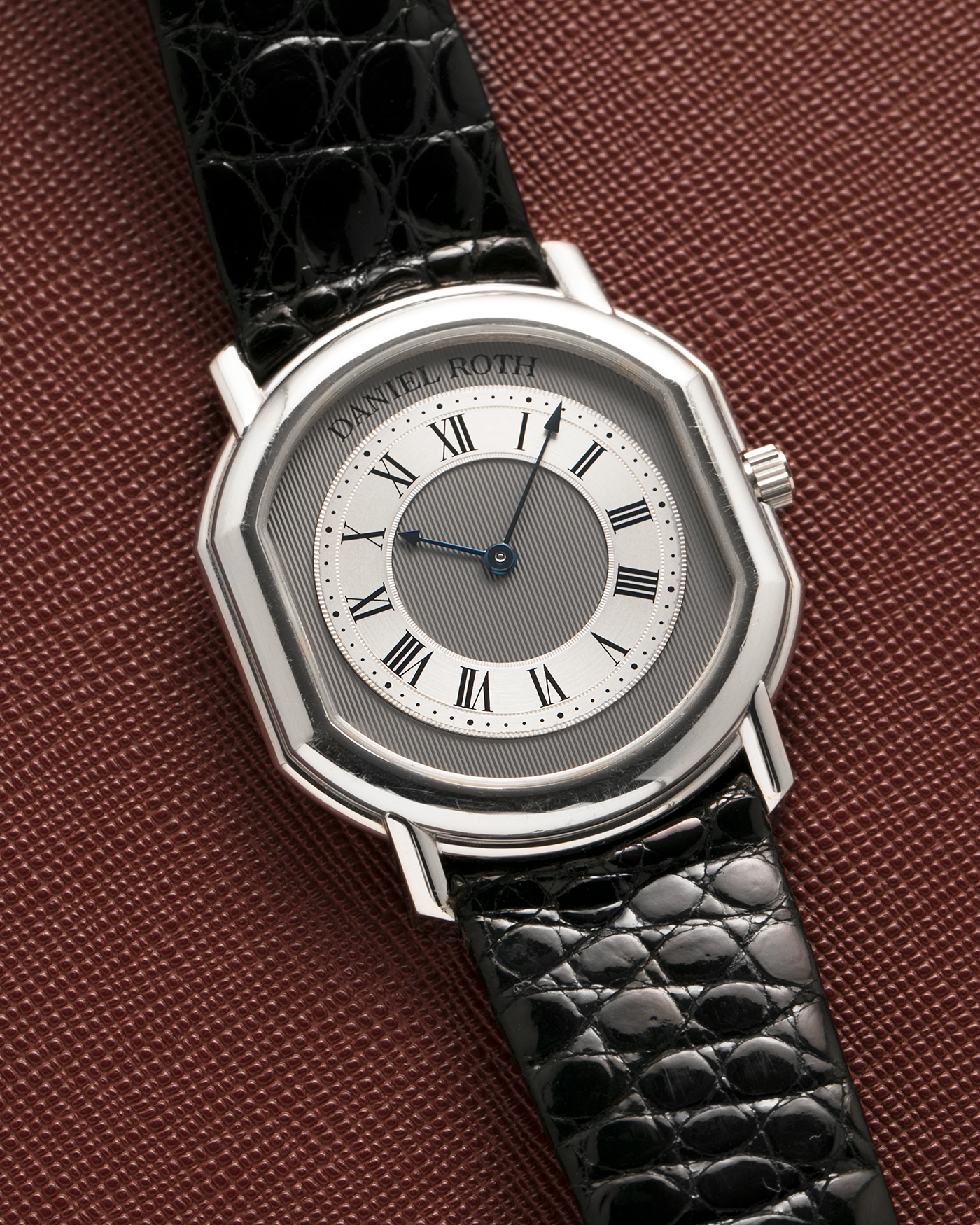 Brand: Daniel Roth
Year: 1990’s
Model: 2107
Material: Platinum 950
Movement: Frederic Piguet Cal. 71, Self-Winding
Case Dimensions: 35mm x 38mm x 6.5mm (Lug-to-Lug 41mm)
Lug Width: 20mm
Strap: Daniel Roth Black Alligator Leather Strap with Signed Platinum 950 Tang Buckle