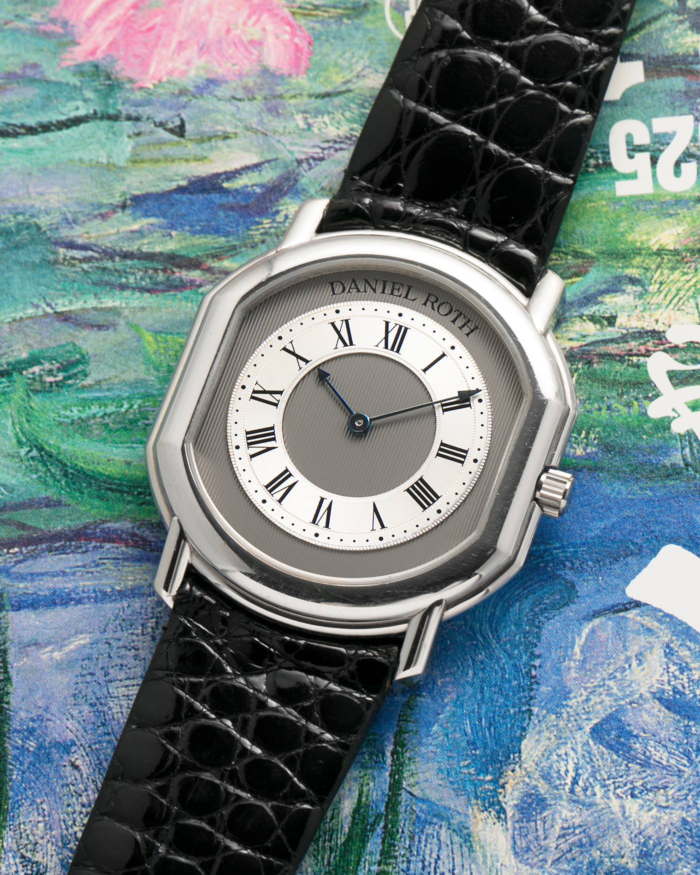 Brand: Daniel Roth
Year: 1990’s
Model: 2107
Material: Platinum 950
Movement: Frederic Piguet Cal. 71, Self-Winding
Case Dimensions: 35mm x 38mm x 6.5mm (Lug-to-Lug 41mm)
Lug Width: 20mm
Strap: Daniel Roth Black Alligator Leather Strap with Signed Platinum 950 Tang Buckle