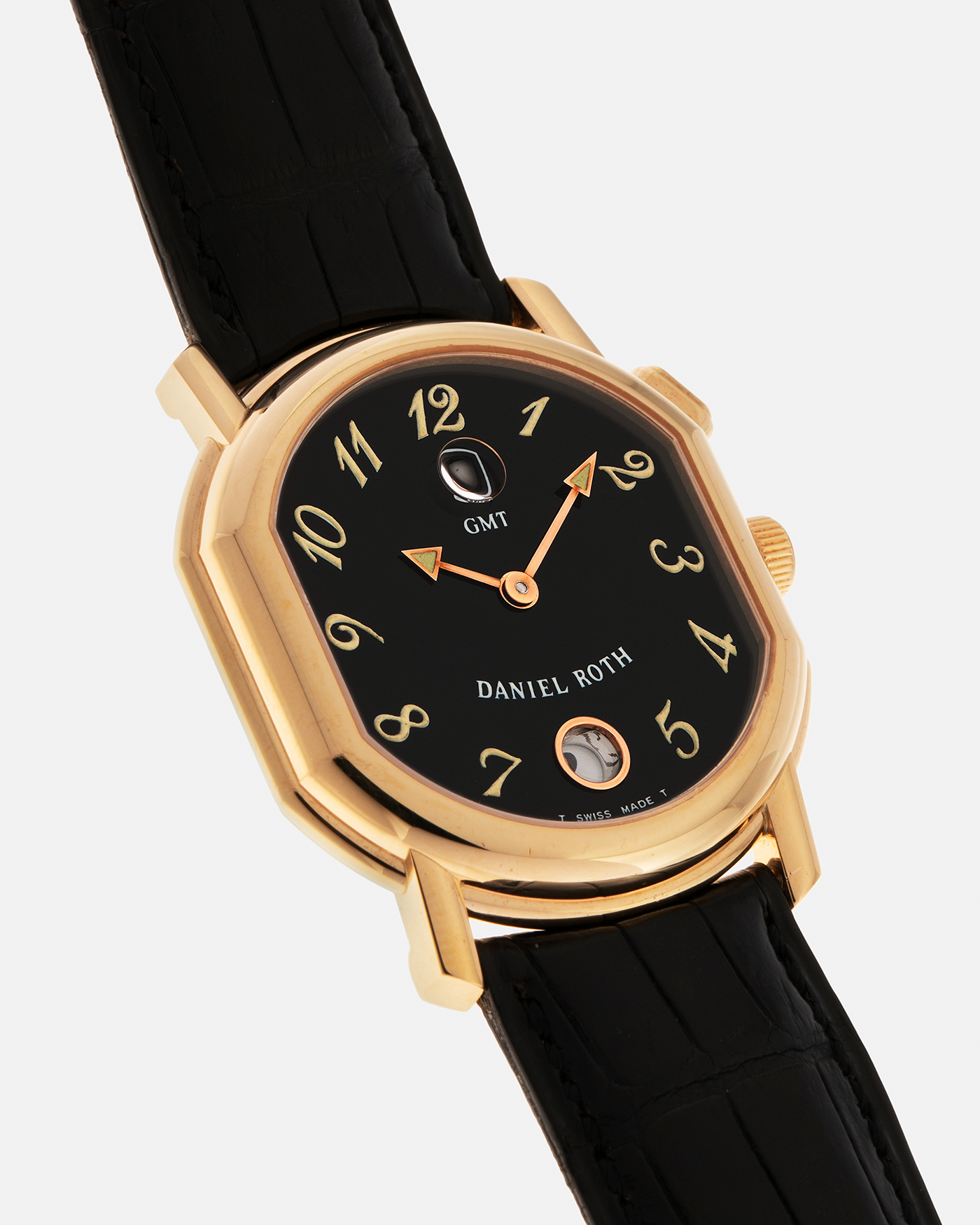 Brand: Daniel Roth
Year: 1990s
Model: GMT
Material: 18-carat Yellow Gold
Movement: Heavily-Modified Girard Perregaux Cal. GP3100, Self-Winding
Case Diameter: 35mm x 38mm (Lug-to-Lug 41mm)
Lug Width: 19mm
Strap: Cellini Black Alligator Leather Strap with Signed 18-carat Yellow Gold Tang Buckle