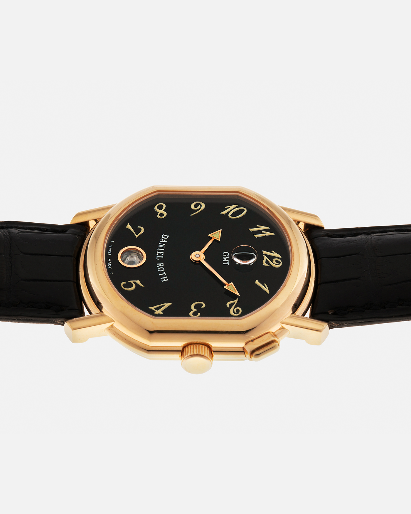 Brand: Daniel Roth
Year: 1990s
Model: GMT
Material: 18-carat Yellow Gold
Movement: Heavily-Modified Girard Perregaux Cal. GP3100, Self-Winding
Case Diameter: 35mm x 38mm (Lug-to-Lug 41mm)
Lug Width: 19mm
Strap: Cellini Black Alligator Leather Strap with Signed 18-carat Yellow Gold Tang Buckle