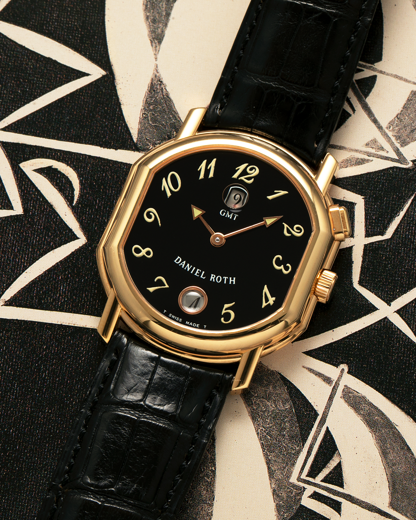 Brand: Daniel Roth
Year: 1990s
Model: GMT
Material: 18-carat Yellow Gold
Movement: Heavily-Modified Girard Perregaux Cal. GP3100, Self-Winding
Case Diameter: 35mm x 38mm (Lug-to-Lug 41mm)
Lug Width: 19mm
Strap: Cellini Black Alligator Leather Strap with Signed 18-carat Yellow Gold Tang Buckle