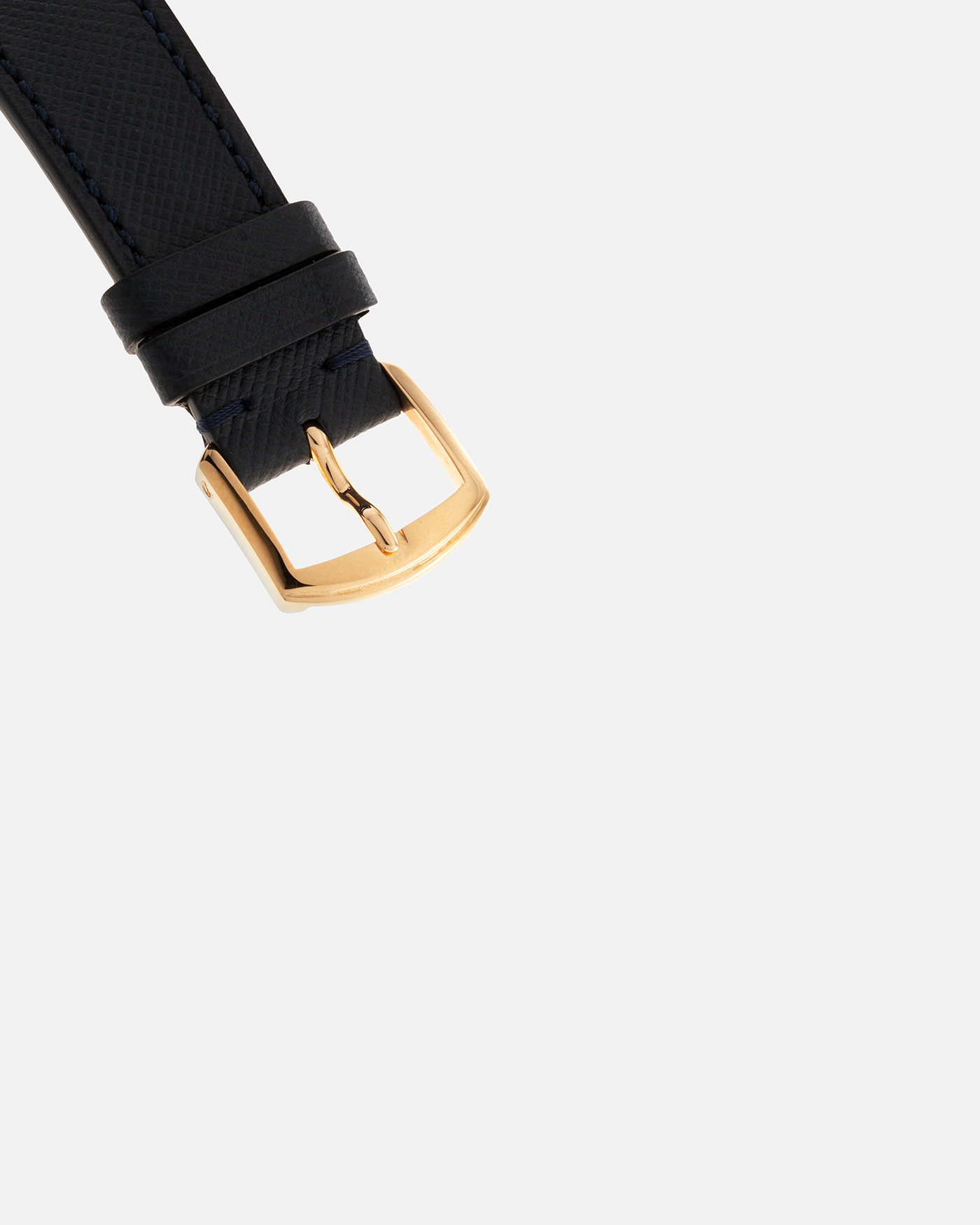 Brand: Daniel Roth Year: Early 1990s Model: Midi Plat Black Dial Reference Number: 2167 Material: 18-carat Yellow Gold  Movement: Daniel Roth Cal. 196, Manual-Winding Case Diameter: 37mm x 32mm Lug Width: 18mm Strap: Molequin Navy Textured Calf Leather Strap with Signed 18-carat Yellow Gold Tang Buckle