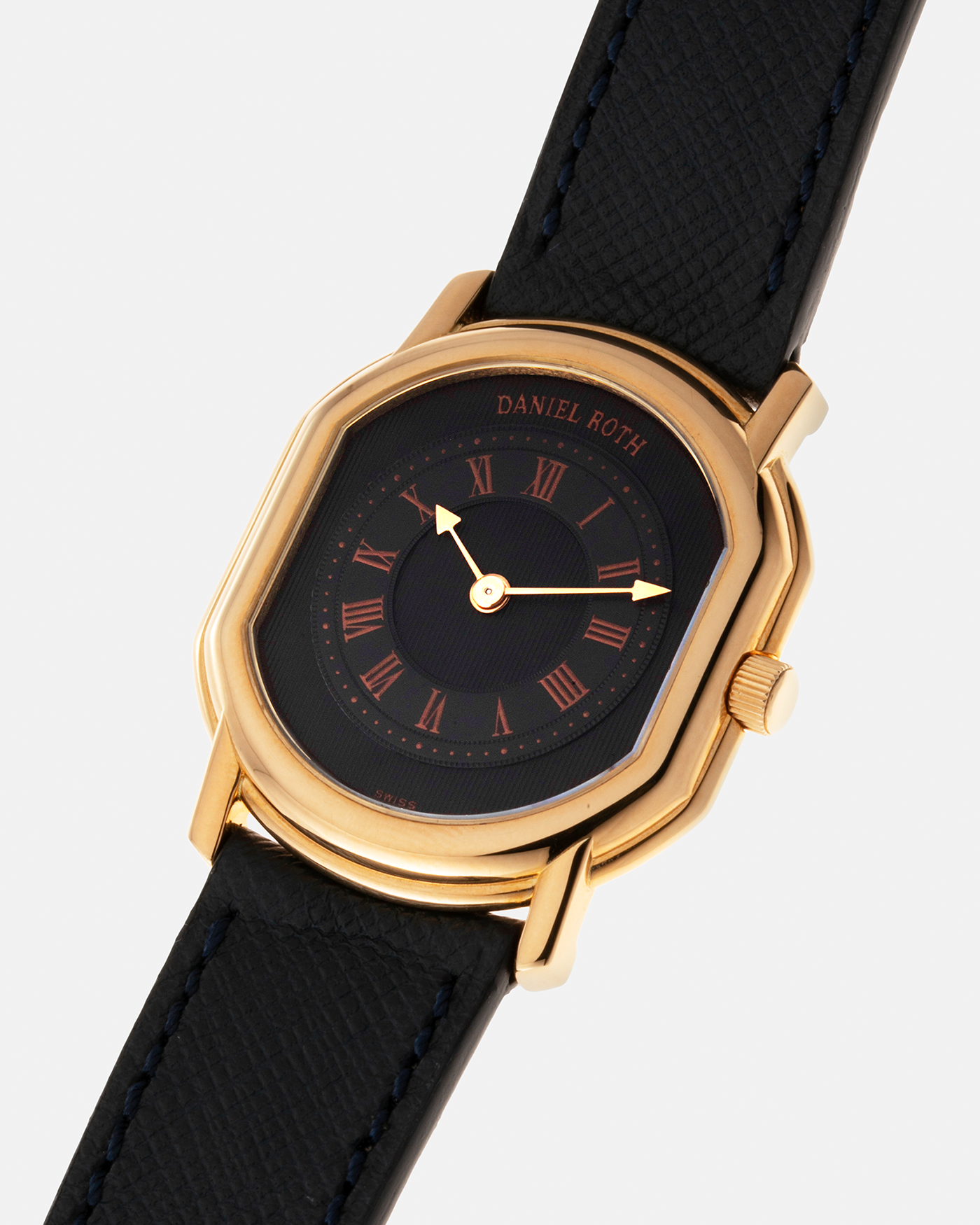 Brand: Daniel Roth Year: Early 1990s Model: Midi Plat Black Dial Reference Number: 2167 Material: 18-carat Yellow Gold  Movement: Daniel Roth Cal. 196, Manual-Winding Case Diameter: 37mm x 32mm Lug Width: 18mm Strap: Molequin Navy Textured Calf Leather Strap with Signed 18-carat Yellow Gold Tang Buckle