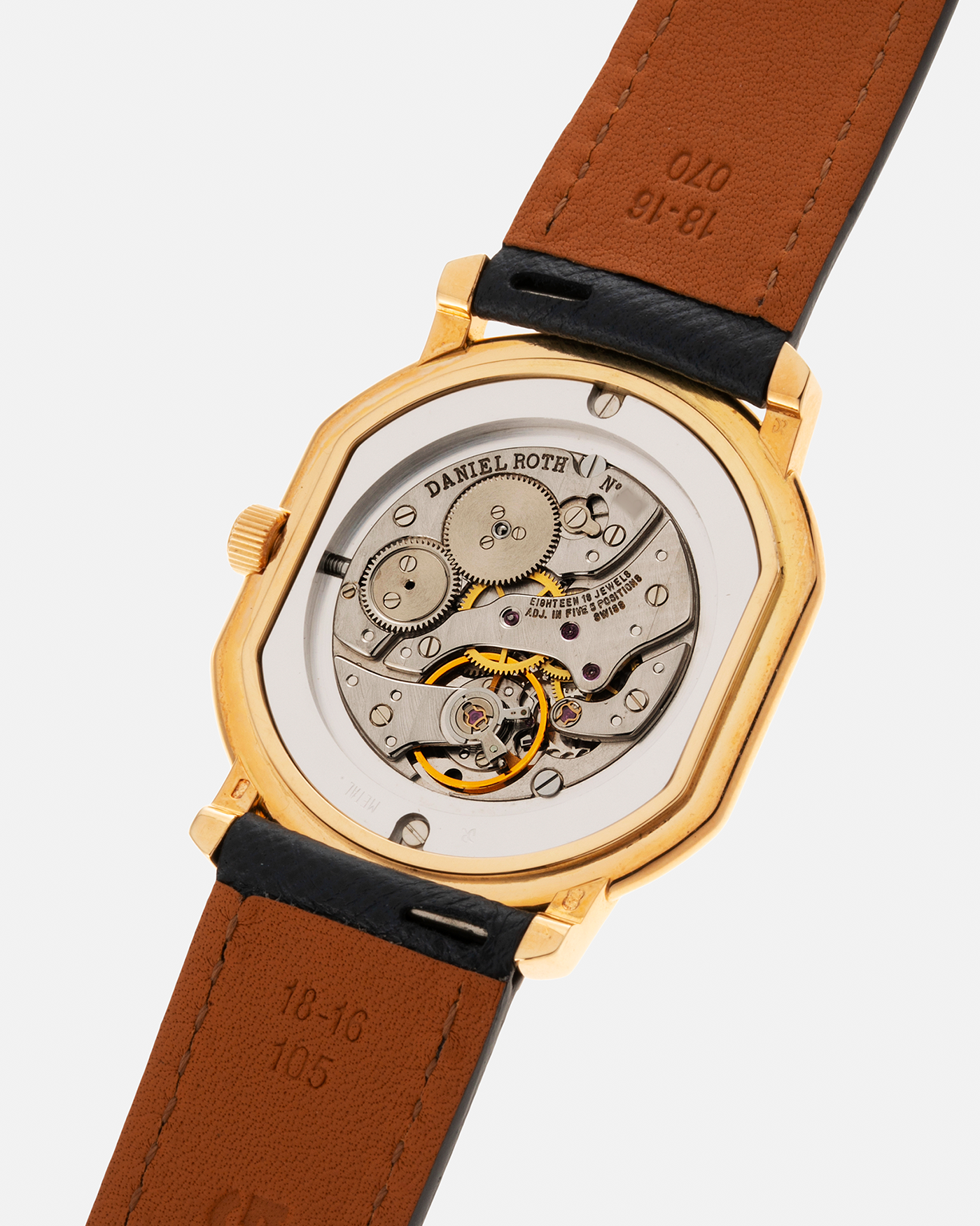 Brand: Daniel Roth Year: Early 1990s Model: Midi Plat Black Dial Reference Number: 2167 Material: 18-carat Yellow Gold  Movement: Daniel Roth Cal. 196, Manual-Winding Case Diameter: 37mm x 32mm Lug Width: 18mm Strap: Molequin Navy Textured Calf Leather Strap with Signed 18-carat Yellow Gold Tang Buckle