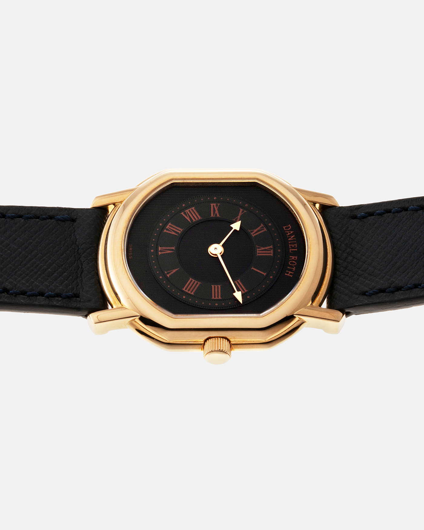Brand: Daniel Roth Year: Early 1990s Model: Midi Plat Black Dial Reference Number: 2167 Material: 18-carat Yellow Gold  Movement: Daniel Roth Cal. 196, Manual-Winding Case Diameter: 37mm x 32mm Lug Width: 18mm Strap: Molequin Navy Textured Calf Leather Strap with Signed 18-carat Yellow Gold Tang Buckle