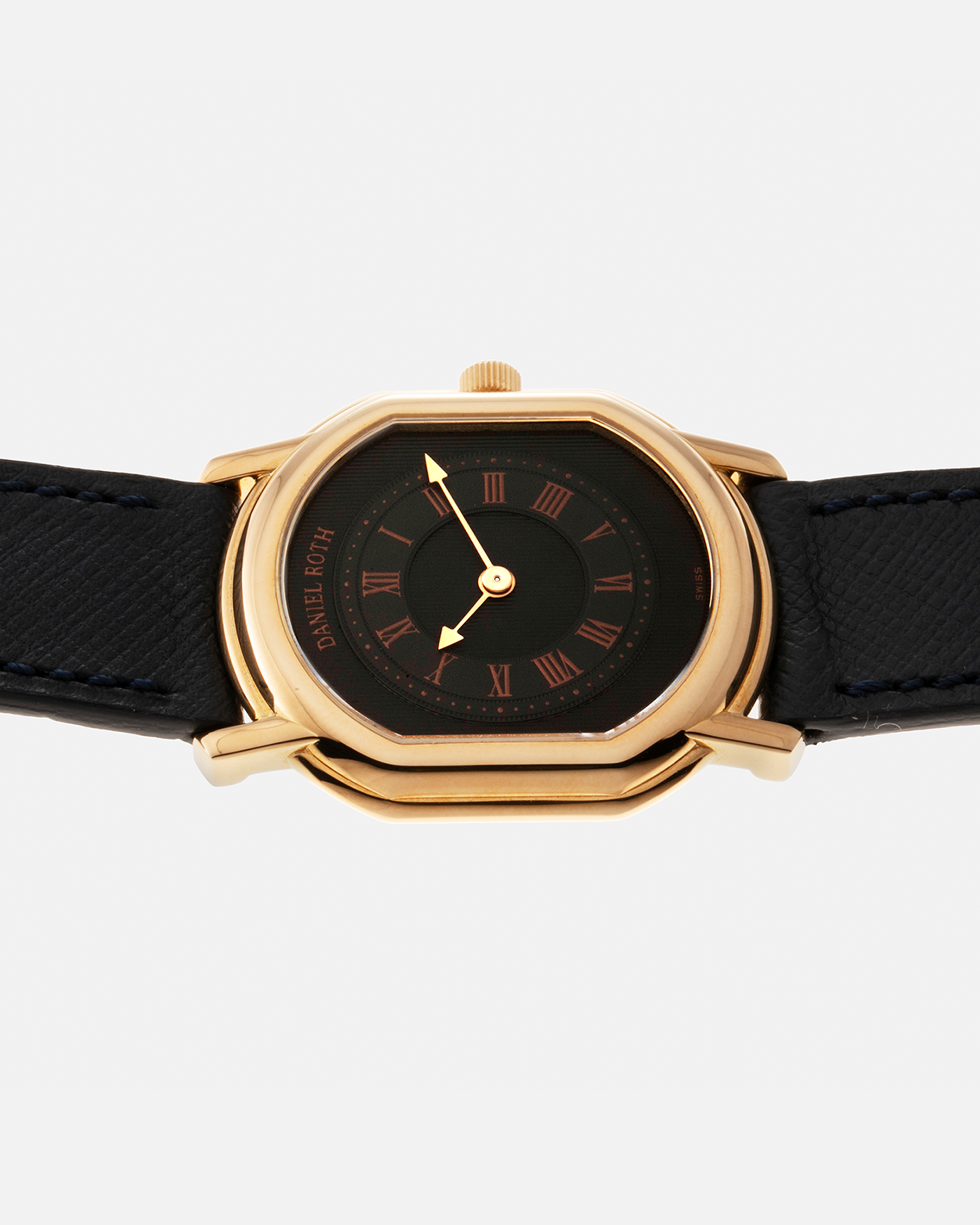 Brand: Daniel Roth Year: Early 1990s Model: Midi Plat Black Dial Reference Number: 2167 Material: 18-carat Yellow Gold  Movement: Daniel Roth Cal. 196, Manual-Winding Case Diameter: 37mm x 32mm Lug Width: 18mm Strap: Molequin Navy Textured Calf Leather Strap with Signed 18-carat Yellow Gold Tang Buckle