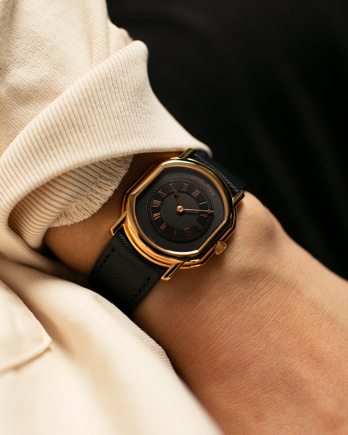 Brand: Daniel Roth Year: Early 1990s Model: Midi Plat Black Dial Reference Number: 2167 Material: 18-carat Yellow Gold  Movement: Daniel Roth Cal. 196, Manual-Winding Case Diameter: 37mm x 32mm Lug Width: 18mm Strap: Molequin Navy Textured Calf Leather Strap with Signed 18-carat Yellow Gold Tang Buckle