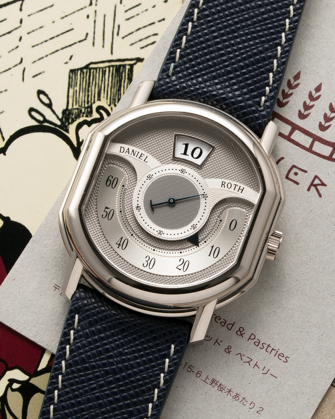 Brand: Daniel Roth Year: 1999 Model: 10th Anniversary Papillon, Limited Edition (White Gold in 110 pieces) Material: 18-carat White Gold Movement: Daniel Roth Cal. DR113, Self-Winding Case Diameter: 35mm x 41mm x 11mm Bracelet/Strap: Navy Blue Saffiano Leather Strap with Signed 18-carat White Gold Tang Buckle