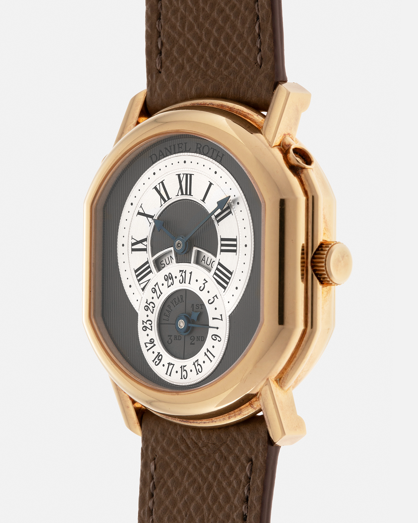 Brand: Daniel Roth
Year: Early 1990’s
Model: 2117 Perpetual Calendar (First Generation)
Material: 18-carat Yellow Gold
Movement: Daniel Roth Cal. DR117 (Based on Lemania Cal. 8810), Self-Winding
Case Dimensions: 35mm x 38mm (Lug-to-Lug 41mm)
Lug Width: 20mm
Strap: Nostime Taupe Brown Textured Calf Leather Strap with Signed 18-carat Yellow Gold Tang Buckle