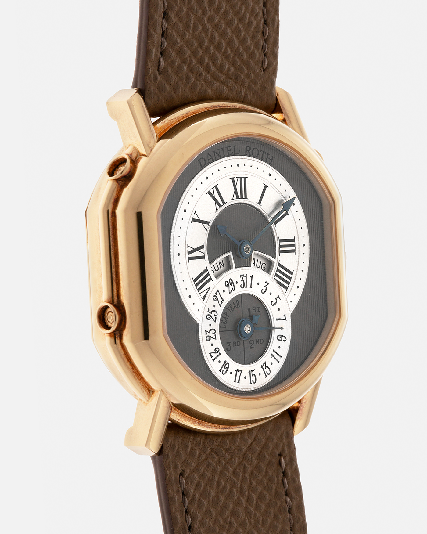 Brand: Daniel Roth
Year: Early 1990’s
Model: 2117 Perpetual Calendar (First Generation)
Material: 18-carat Yellow Gold
Movement: Daniel Roth Cal. DR117 (Based on Lemania Cal. 8810), Self-Winding
Case Dimensions: 35mm x 38mm (Lug-to-Lug 41mm)
Lug Width: 20mm
Strap: Nostime Taupe Brown Textured Calf Leather Strap with Signed 18-carat Yellow Gold Tang Buckle