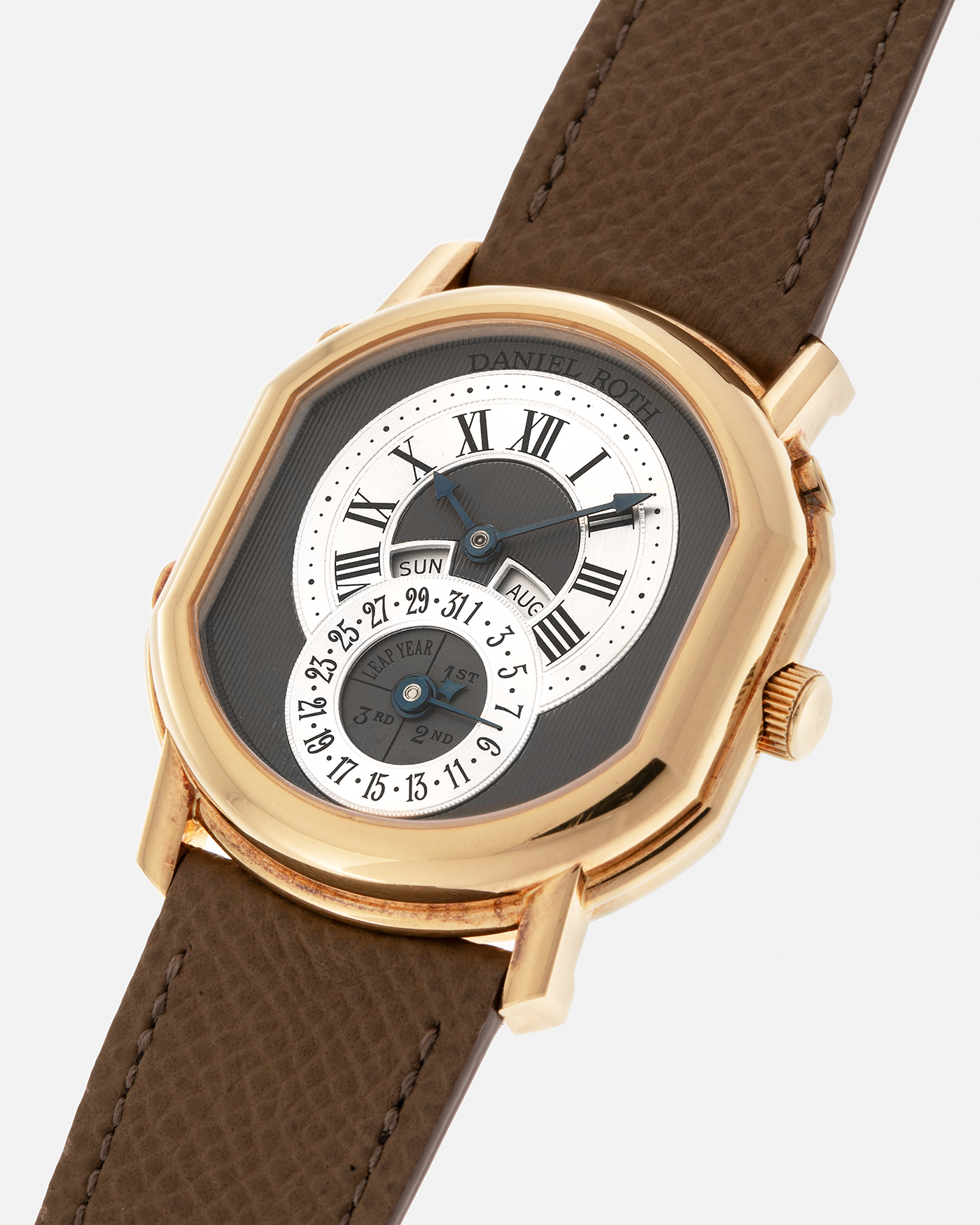 Brand: Daniel Roth
Year: Early 1990’s
Model: 2117 Perpetual Calendar (First Generation)
Material: 18-carat Yellow Gold
Movement: Daniel Roth Cal. DR117 (Based on Lemania Cal. 8810), Self-Winding
Case Dimensions: 35mm x 38mm (Lug-to-Lug 41mm)
Lug Width: 20mm
Strap: Nostime Taupe Brown Textured Calf Leather Strap with Signed 18-carat Yellow Gold Tang Buckle