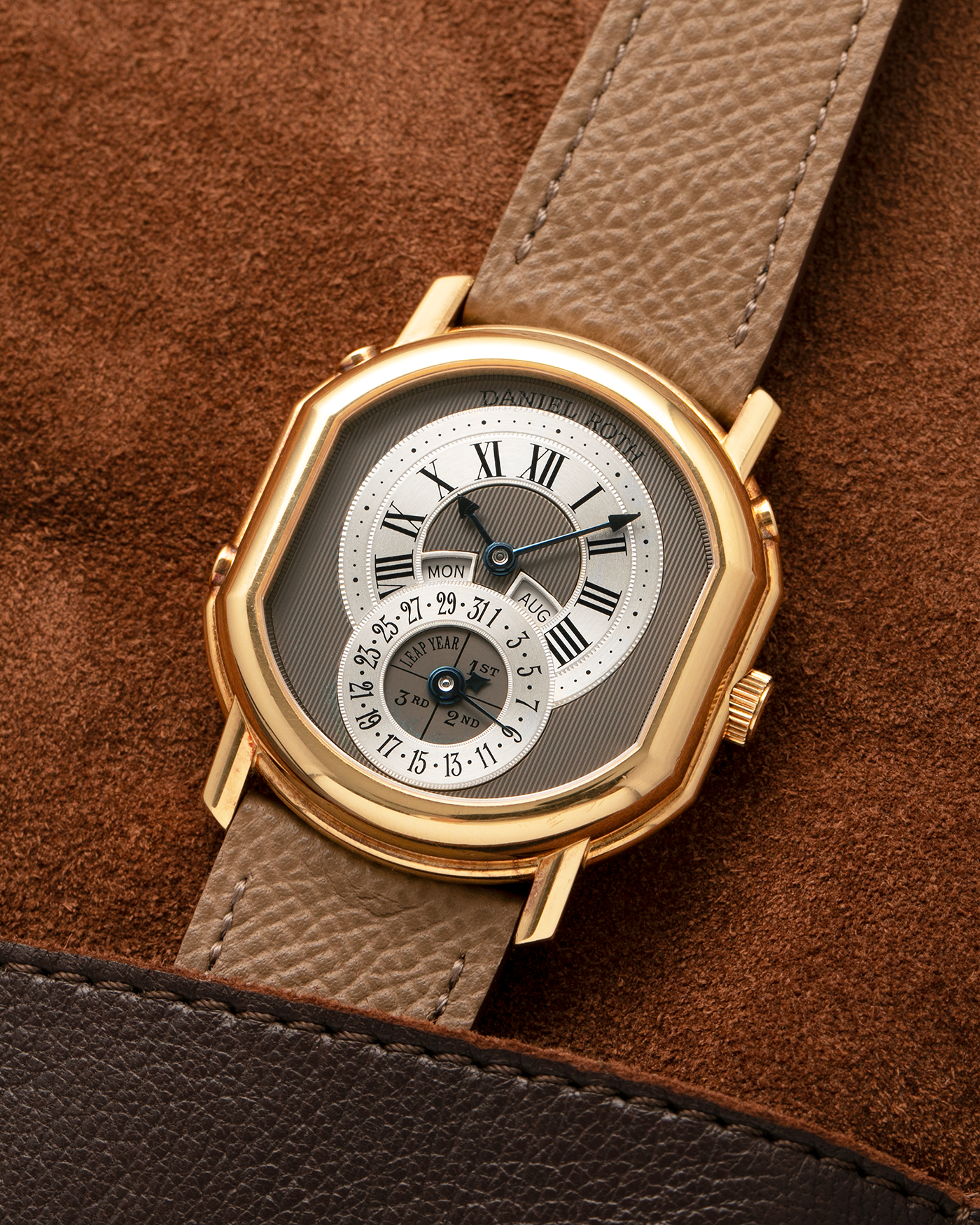 Brand: Daniel Roth
Year: Early 1990’s
Model: 2117 Perpetual Calendar (First Generation)
Material: 18-carat Yellow Gold
Movement: Daniel Roth Cal. DR117 (Based on Lemania Cal. 8810), Self-Winding
Case Dimensions: 35mm x 38mm (Lug-to-Lug 41mm)
Lug Width: 20mm
Strap: Nostime Taupe Brown Textured Calf Leather Strap with Signed 18-carat Yellow Gold Tang Buckle