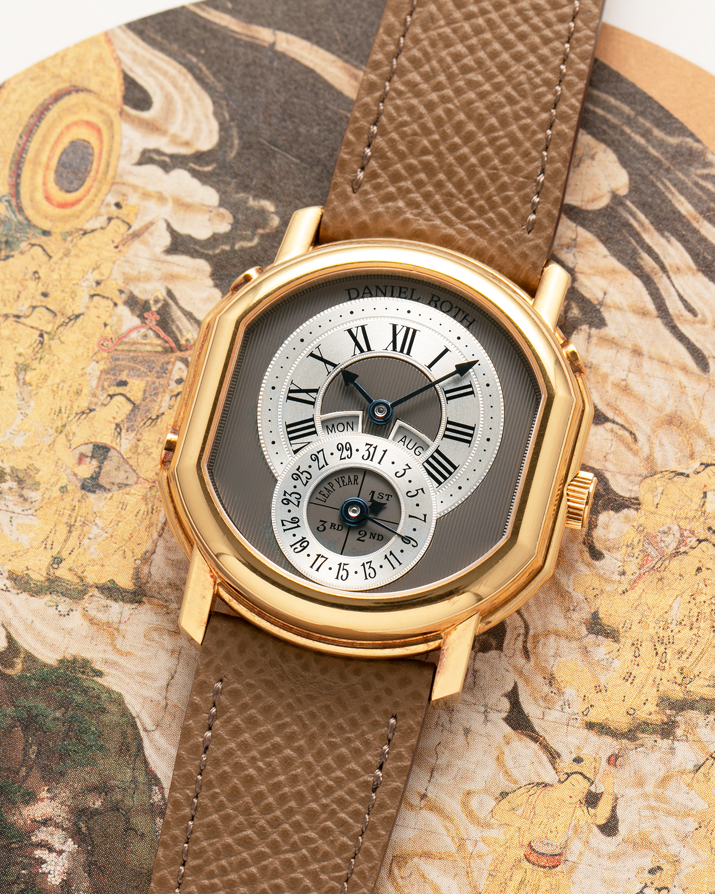 Brand: Daniel Roth
Year: Early 1990’s
Model: 2117 Perpetual Calendar (First Generation)
Material: 18-carat Yellow Gold
Movement: Daniel Roth Cal. DR117 (Based on Lemania Cal. 8810), Self-Winding
Case Dimensions: 35mm x 38mm (Lug-to-Lug 41mm)
Lug Width: 20mm
Strap: Nostime Taupe Brown Textured Calf Leather Strap with Signed 18-carat Yellow Gold Tang Buckle