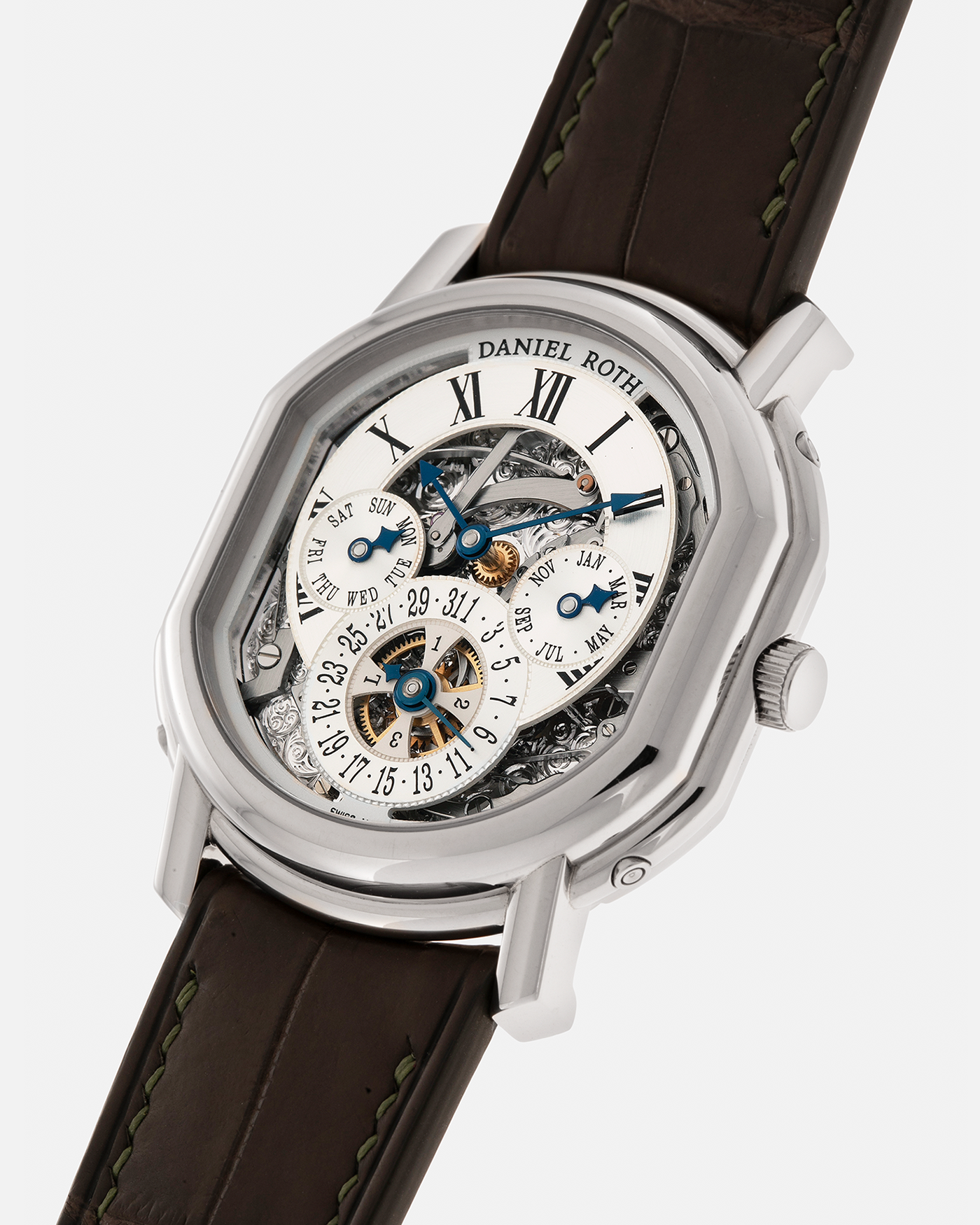 Brand: Daniel Roth
Year: 1990’s
Model: Perpetual Calendar Skeleton
Reference: 119.X.60
Material: 18-carat White Gold
Movement: Daniel Roth Cal. DR114 (Based on Girard-Perregaux GP3000), Self-Winding
Case Dimensions: 41mm (Including Lugs) x 38mm x 9.8mm
Lug Width: 20mm
Straps: Custom Dark Brown Alligator Leather Strap with Signed 18-carat White Gold Tang Buckle, with extra Daniel Roth Black Alligator Leather Strap