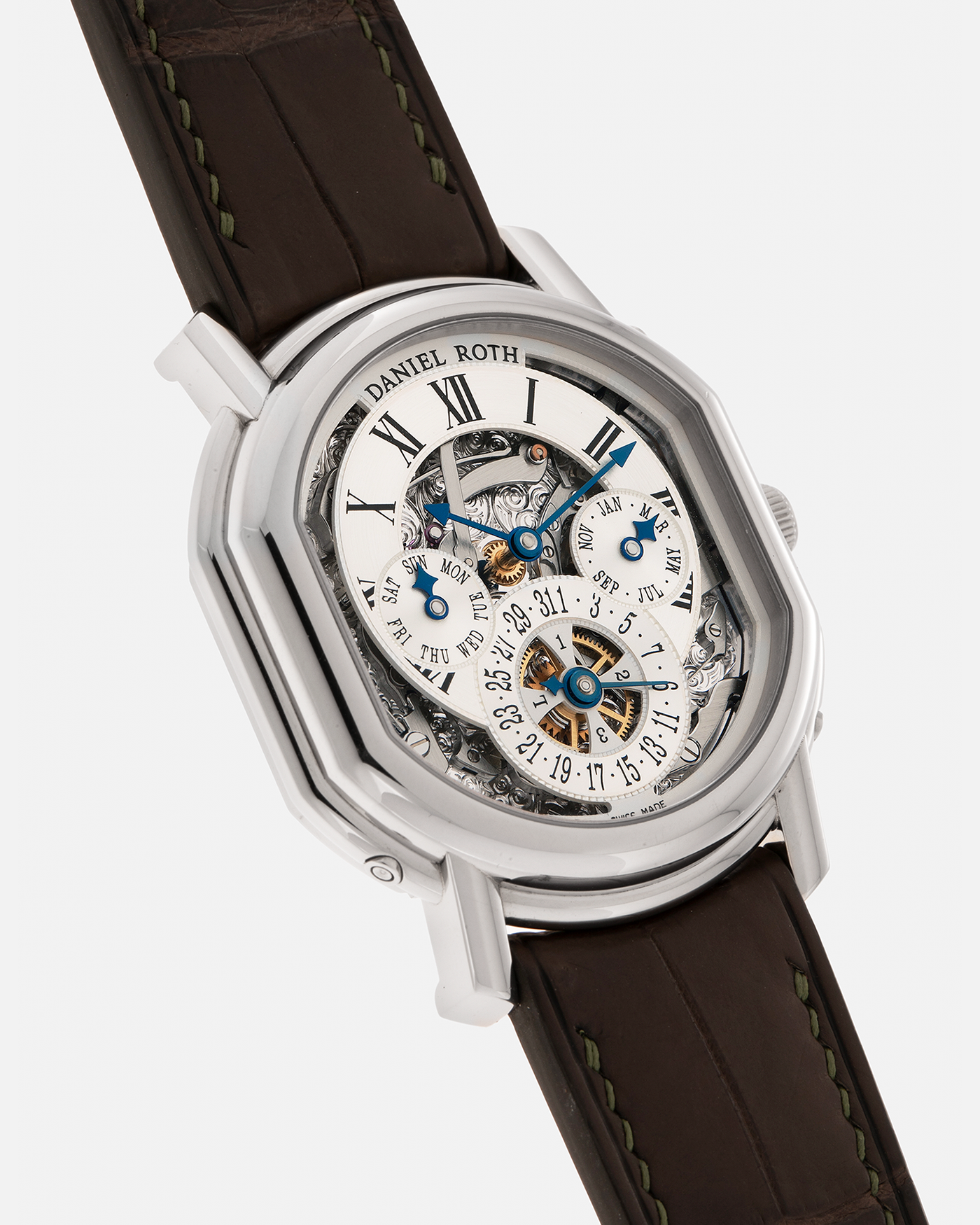 Brand: Daniel Roth
Year: 1990’s
Model: Perpetual Calendar Skeleton
Reference: 119.X.60
Material: 18-carat White Gold
Movement: Daniel Roth Cal. DR114 (Based on Girard-Perregaux GP3000), Self-Winding
Case Dimensions: 41mm (Including Lugs) x 38mm x 9.8mm
Lug Width: 20mm
Straps: Custom Dark Brown Alligator Leather Strap with Signed 18-carat White Gold Tang Buckle, with extra Daniel Roth Black Alligator Leather Strap