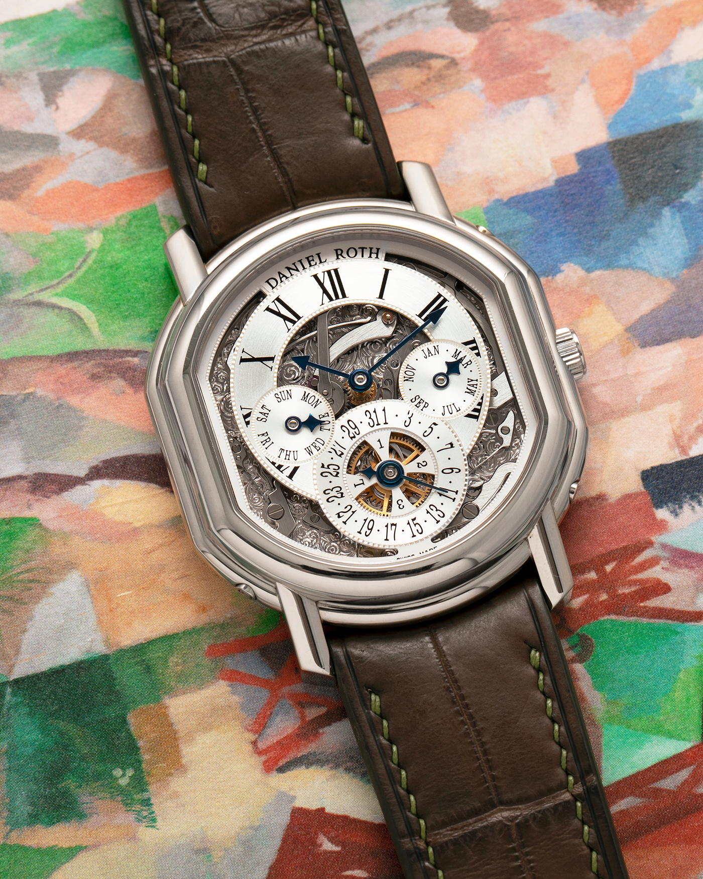Brand: Daniel Roth
Year: 1990’s
Model: Perpetual Calendar Skeleton
Reference: 119.X.60
Material: 18-carat White Gold
Movement: Daniel Roth Cal. DR114 (Based on Girard-Perregaux GP3000), Self-Winding
Case Dimensions: 41mm (Including Lugs) x 38mm x 9.8mm
Lug Width: 20mm
Straps: Custom Dark Brown Alligator Leather Strap with Signed 18-carat White Gold Tang Buckle, with extra Daniel Roth Black Alligator Leather Strap