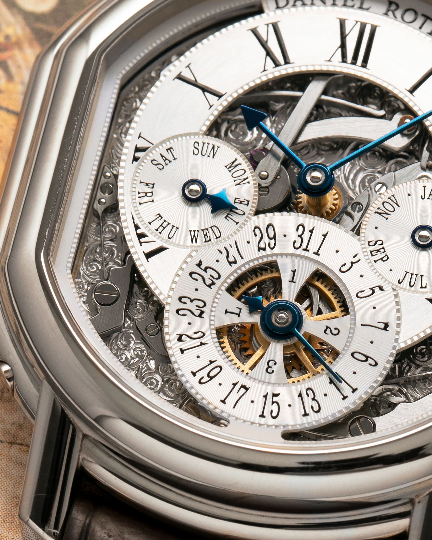 Brand: Daniel Roth
Year: 1990’s
Model: Perpetual Calendar Skeleton
Reference: 119.X.60
Material: 18-carat White Gold
Movement: Daniel Roth Cal. DR114 (Based on Girard-Perregaux GP3000), Self-Winding
Case Dimensions: 41mm (Including Lugs) x 38mm x 9.8mm
Lug Width: 20mm
Straps: Custom Dark Brown Alligator Leather Strap with Signed 18-carat White Gold Tang Buckle, with extra Daniel Roth Black Alligator Leather Strap