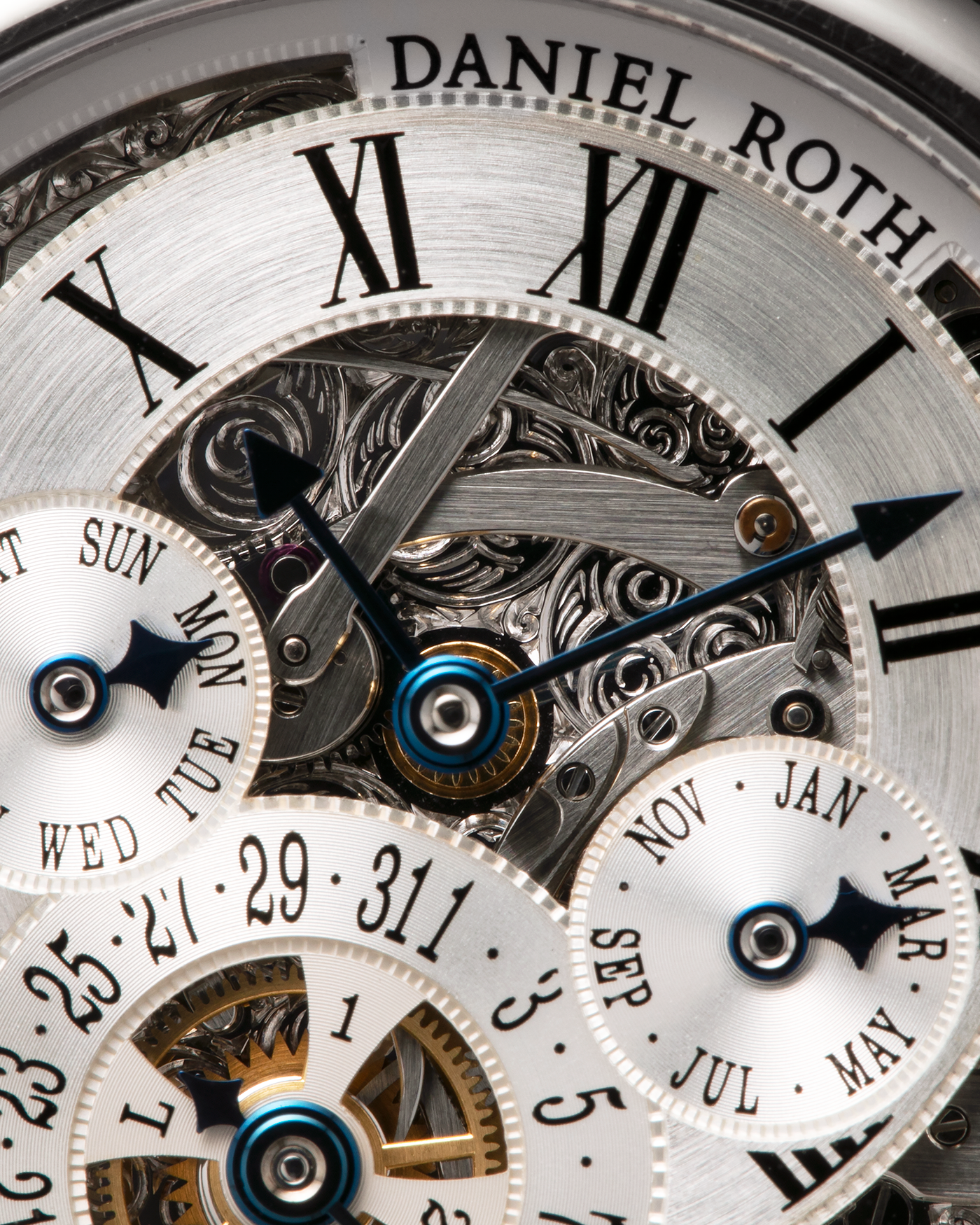 Brand: Daniel Roth
Year: 1990’s
Model: Perpetual Calendar Skeleton
Reference: 119.X.60
Material: 18-carat White Gold
Movement: Daniel Roth Cal. DR114 (Based on Girard-Perregaux GP3000), Self-Winding
Case Dimensions: 41mm (Including Lugs) x 38mm x 9.8mm
Lug Width: 20mm
Straps: Custom Dark Brown Alligator Leather Strap with Signed 18-carat White Gold Tang Buckle, with extra Daniel Roth Black Alligator Leather Strap