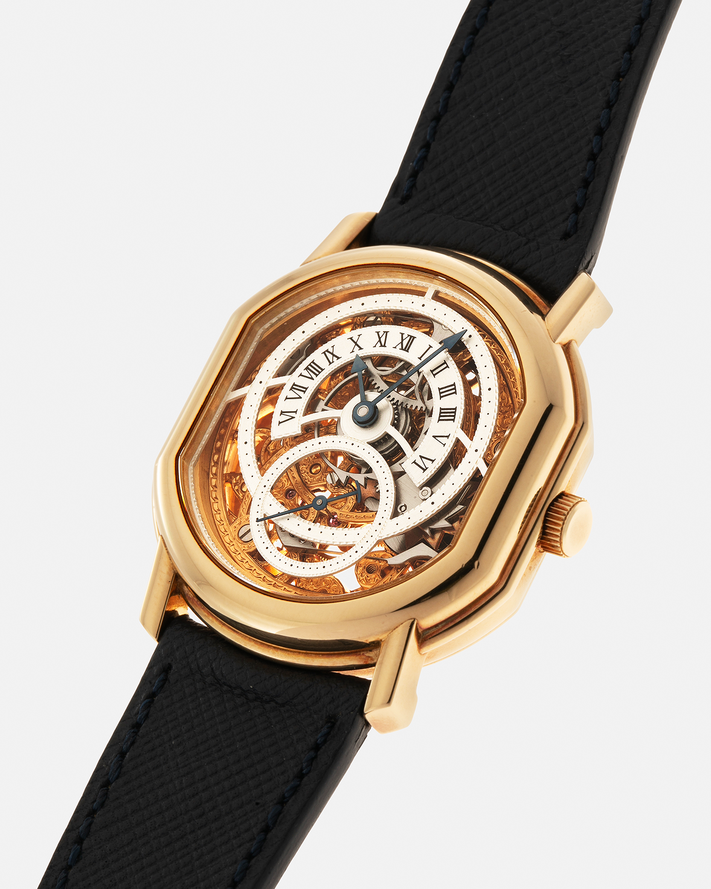 Brand: Daniel Roth
Year: 1990’s
Model: 2127 Retrograde Skeleton
Material: 18-carat Yellow Gold
Movement: Lemania Cal. 27LN with Retrograde Function, Manual-Winding
Case Diameter: 35mm x 38mm (41mm Lug-to-Lug)
Lug Width: 20mm
Strap: Molequin Navy Blue Grained Calf Strap with Signed 18-carat Yellow Gold Tang Buckle
