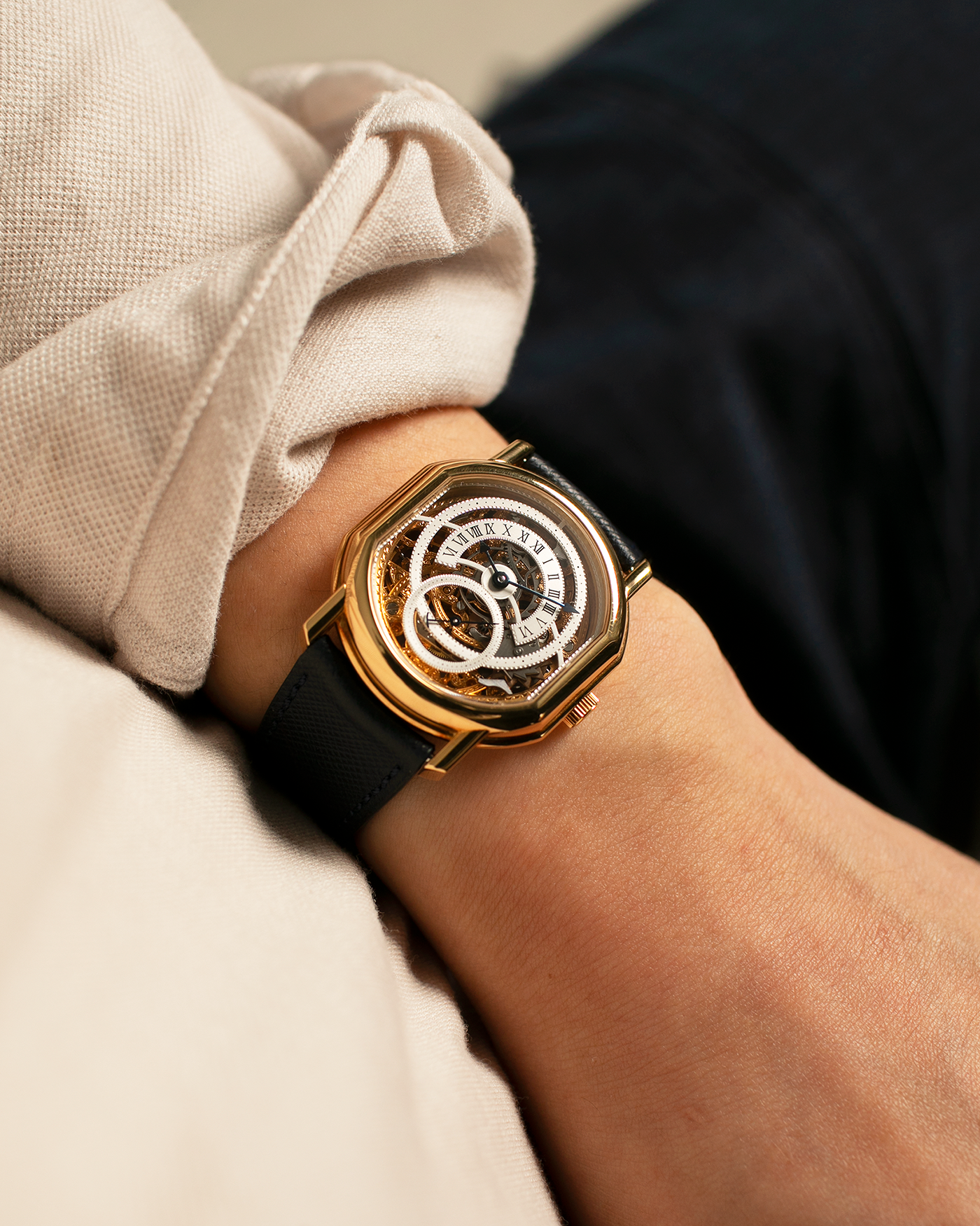 Brand: Daniel Roth
Year: 1990’s
Model: 2127 Retrograde Skeleton
Material: 18-carat Yellow Gold
Movement: Lemania Cal. 27LN with Retrograde Function, Manual-Winding
Case Diameter: 35mm x 38mm (41mm Lug-to-Lug)
Lug Width: 20mm
Strap: Molequin Navy Blue Grained Calf Strap with Signed 18-carat Yellow Gold Tang Buckle