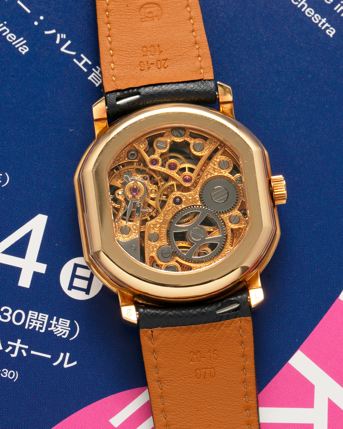 Brand: Daniel Roth
Year: 1990’s
Model: 2127 Retrograde Skeleton
Material: 18-carat Yellow Gold
Movement: Lemania Cal. 27LN with Retrograde Function, Manual-Winding
Case Diameter: 35mm x 38mm (41mm Lug-to-Lug)
Lug Width: 20mm
Strap: Molequin Navy Blue Grained Calf Strap with Signed 18-carat Yellow Gold Tang Buckle