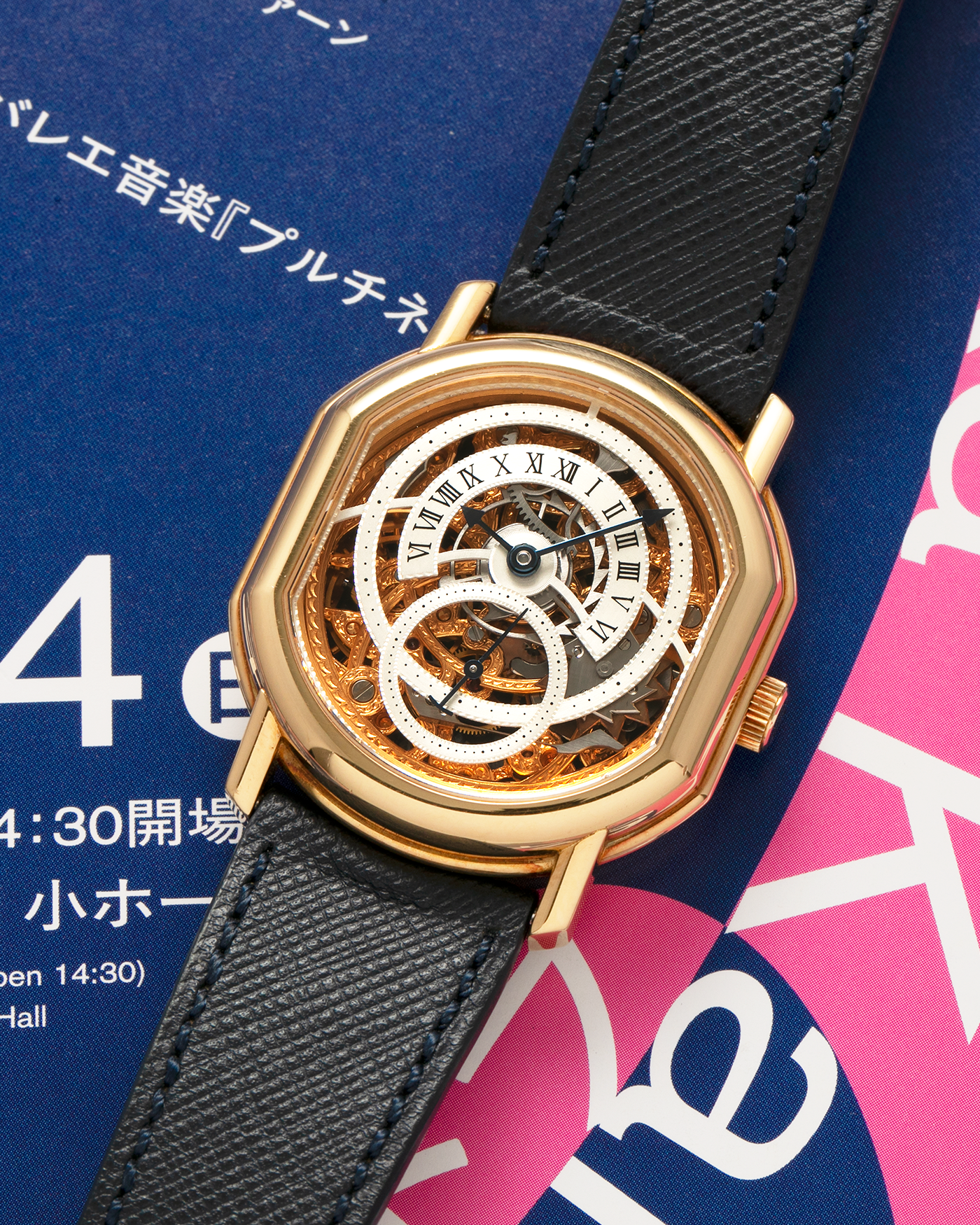 Brand: Daniel Roth
Year: 1990’s
Model: 2127 Retrograde Skeleton
Material: 18-carat Yellow Gold
Movement: Lemania Cal. 27LN with Retrograde Function, Manual-Winding
Case Diameter: 35mm x 38mm (41mm Lug-to-Lug)
Lug Width: 20mm
Strap: Molequin Navy Blue Grained Calf Strap with Signed 18-carat Yellow Gold Tang Buckle