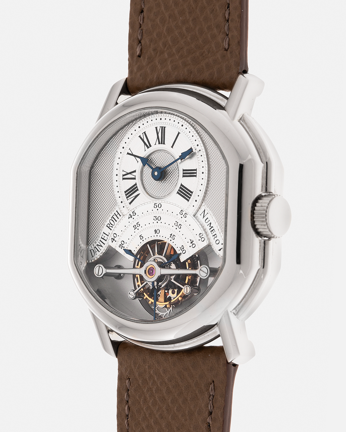 Brand: Daniel Roth
Year: Early 1990’s
Model: 2187 Régulateur Tourbillon Clou De Paris Guilloché (First Generation)
Material: 18-carat White Gold
Movement: Daniel Roth Cal. DR 307 One-Minute Tourbillon (Based on Lemania Cal. 387 Ébauche), Manual-Winding
Case Dimensions: 35mm x 38mm (Lug-to-Lug 41mm)
Lug Width: 20mm
Strap: Nostime Taupe Brown Textured Calf Leather Strap