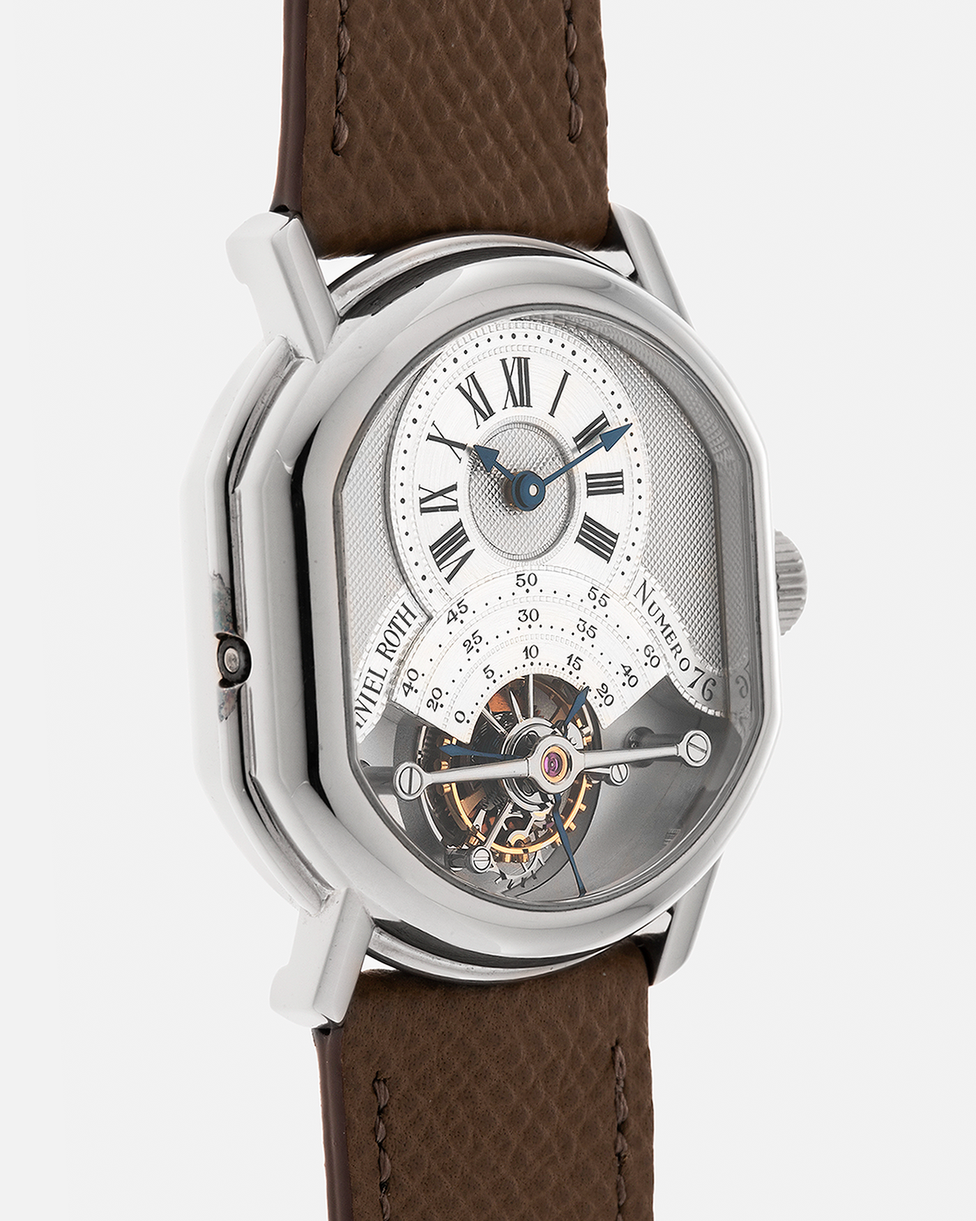 Brand: Daniel Roth
Year: Early 1990’s
Model: 2187 Régulateur Tourbillon Clou De Paris Guilloché (First Generation)
Material: 18-carat White Gold
Movement: Daniel Roth Cal. DR 307 One-Minute Tourbillon (Based on Lemania Cal. 387 Ébauche), Manual-Winding
Case Dimensions: 35mm x 38mm (Lug-to-Lug 41mm)
Lug Width: 20mm
Strap: Nostime Taupe Brown Textured Calf Leather Strap